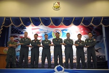 Exercise directors from the U.S. Air Force, Royal Thai Air Force and Republic of Singapore Air Force pose for a group photo during a multilateral in-brief for Cope Tiger 13 Field Training Exercise at Korat Royal Thai Air Force Base, Thailand, March 10, 2013. More than 300 U.S. service members are participating in CT13, which offers an unparalleled opportunity to conduct a wide spectrum of large force employment air operations and strengthen military-to-military ties with two key partner nations, Thailand and Singapore. (U.S. Air Force photo/2nd Lt. Jake Bailey) (Released)