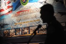 A Royal Thai Air Force representative briefs exercise participants from the U.S. Air Force, Royal Thai Air Force and Republic of Singapore Air Force during a multilateral in-brief for Cope Tiger 13 Field Training Exercise at Korat Royal Thai Air Force Base, Thailand, March 10, 2013. More than 300 U.S. service members are participating in CT13, which offers an unparalleled opportunity to conduct a wide spectrum of large force employment air operations and strengthen military-to-military ties with two key partner nations, Thailand and Singapore. (U.S. Air Force photo/2nd Lt. Jake Bailey) (Released)