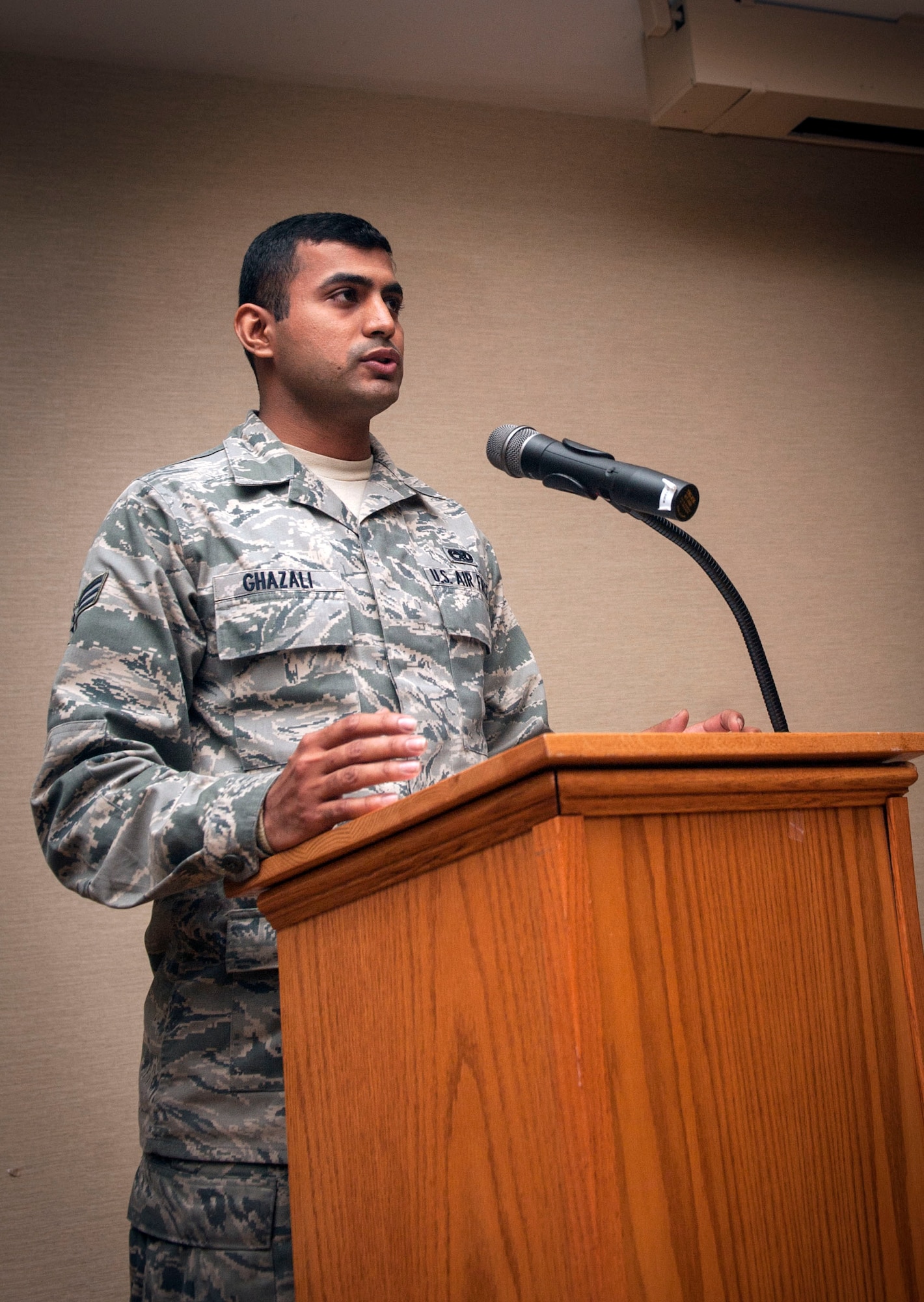 U.S. Air Force Senior Airman Hammad Ghazali, 23d Aircraft Maintenance Squadron, reads a passage from the Quran during Moody’s National Prayer Luncheon at Moody Air Force Base, Ga., March 7, 2013. The luncheon celebrated all faiths with readings from the Quran, Hebrew Scripture and New Testament. (U.S. Air Force photo by Senior Airman Jarrod Grammel/Released) 
