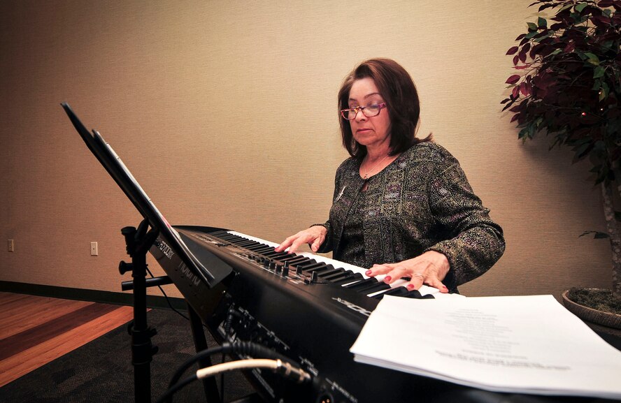 Lynn Williams, 23d Wing Chapel musician, plays the piano at the start of Moody’s National Prayer Luncheon at Moody Air Force Base, Ga., March 7, 2013. The annual event is celebrated in conjunction with the National Prayer Breakfast that is held in the White House. (U.S. Air Force photo by Senior Airman Jarrod Grammel/Released)
