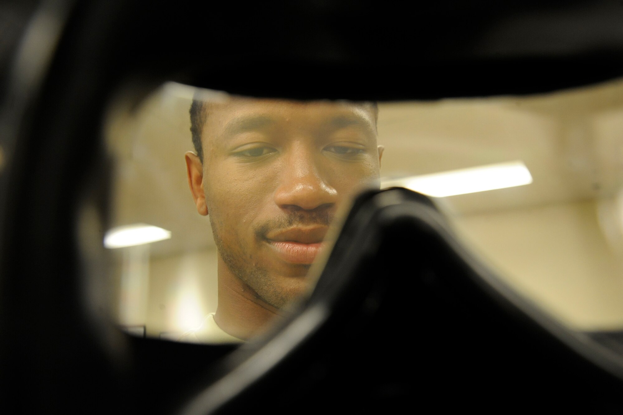Airman 1st Class Melvin Jenkins, 2nd Logistics Readiness Squadron Mobility Flight, inspects an M50 Joint Service General Purpose Mask during routine equipment maintenance on Barksdale Air Force Base, La., March 11. All equipment must be properly maintained to upkeep its serviceability. Routine inspections and removal of expired gear ensures an Airman's survival while at a deployed location. (U.S. Air Force photo/Airman 1st Class Andrew Moua)