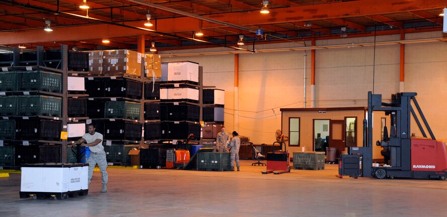 Airmen assigned to the 2nd Logistics Readiness Squadron Mobility Flight move and inventory equipment at the 2 LRS warehouse on Barksdale Air Force Base, La., March 11. Mobility Airmen's responsibilities include the maintenance and upkeep of equipment, such as testing gas mask seals, as well as issuing out gear to deploying Airmen. (U.S. Air Force photo/Airman 1st Class Andrew Moua)