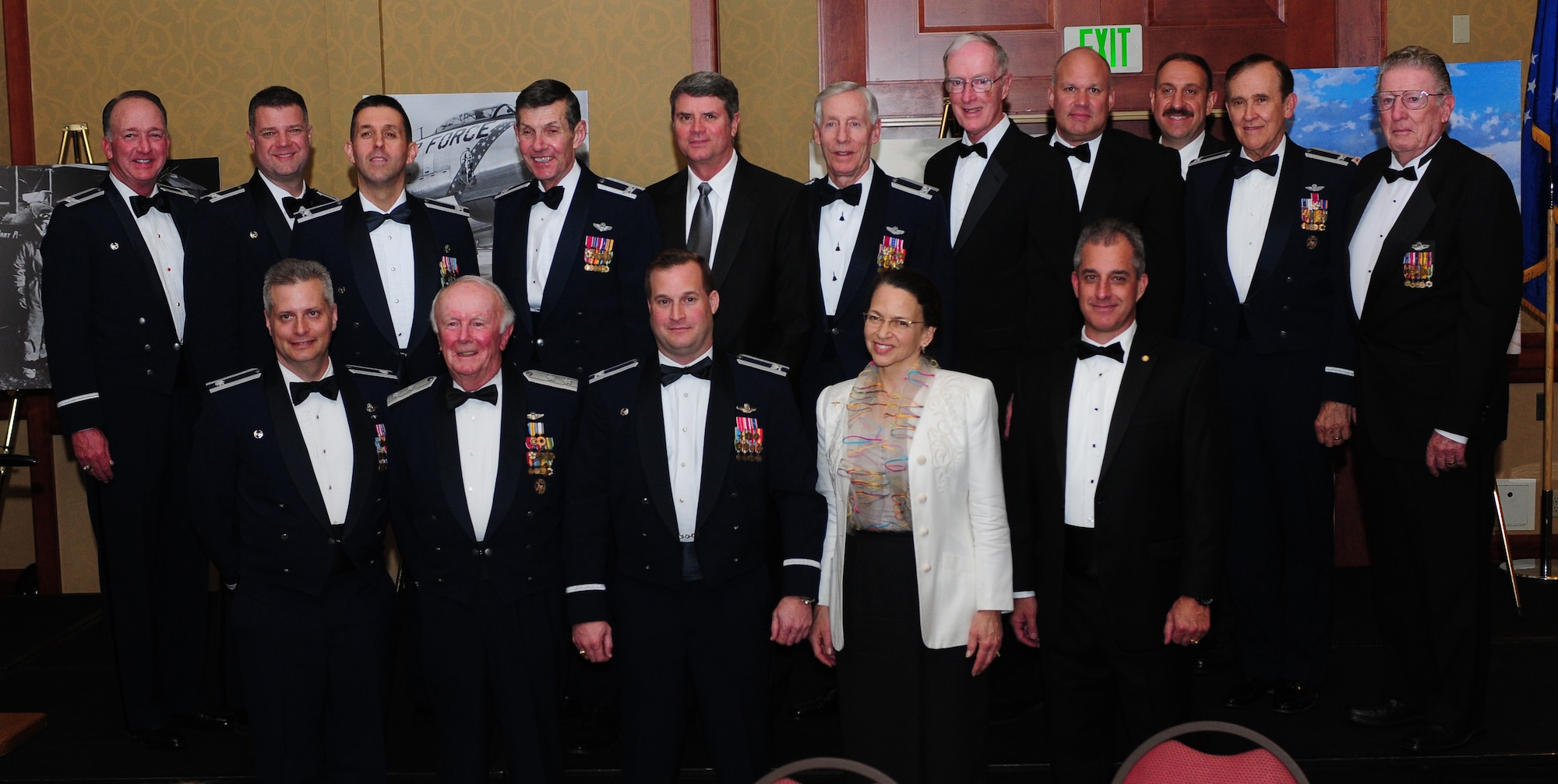 Col. Phil Stewart (lower middle), 9th Reconnaissance Wing commander, and 1st Reconnaissance Squadron past and present commanders pose for a photo during the 1st RS Centennial Celebration at the Sheraton Grand Hotel in Sacramento, Calif., March 9, 2013. Photos were on display showing the evolution of the squadron throughout the last 100 years. (U.S. Air Force photo by Senior Airman Allen Pollard/Released)