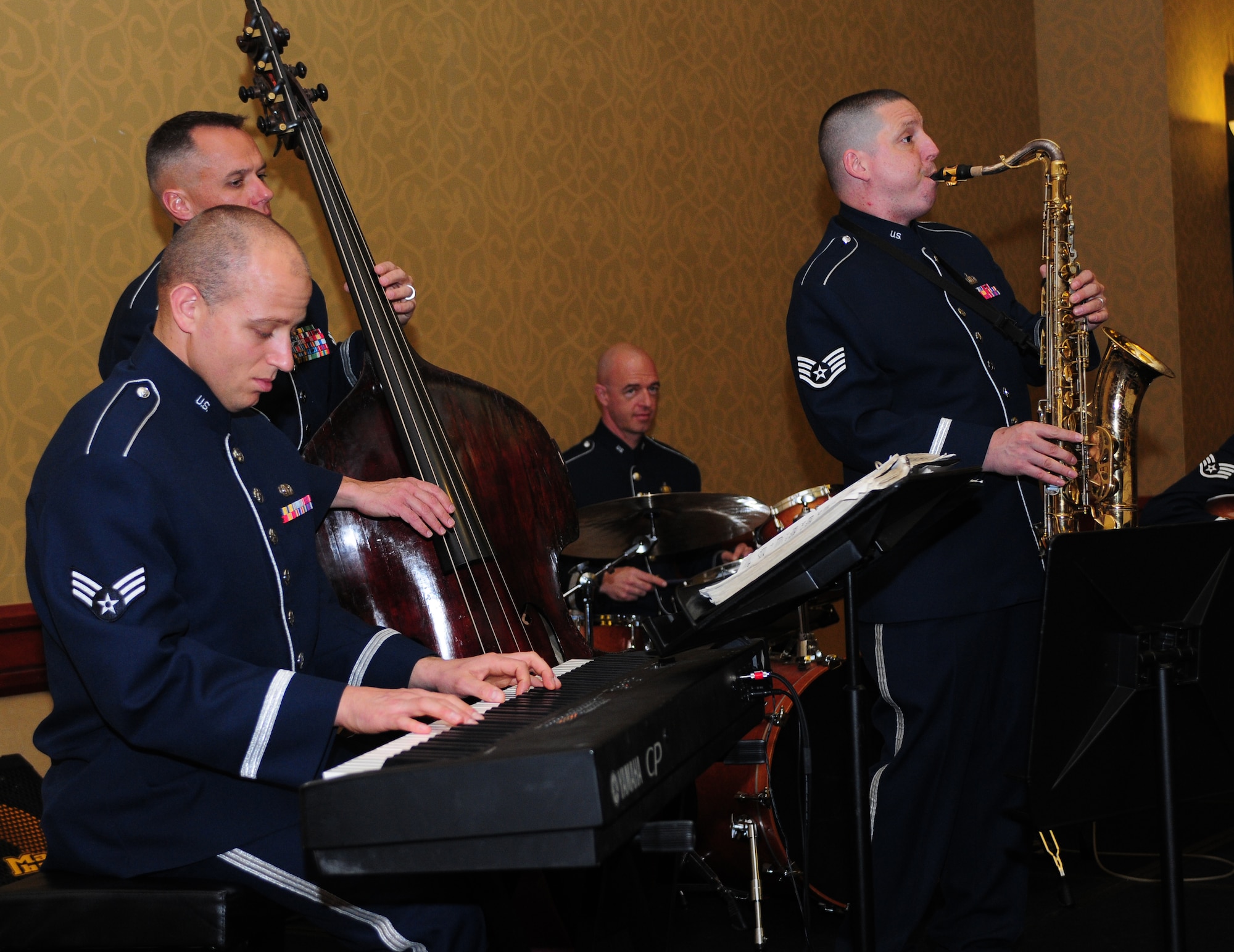 Members of the Air Force Band of Golden West play during the 1st Reconnaissance Squadron Centennial Celebration at the Sheraton Grand Hotel in Sacramento, Calif., March 9, 2013. The event was attended by current and past 1st RS commanders and members of Team Beale. (U.S. Air Force photo by Senior Airman Allen Pollard/Released)