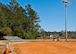 Members of the 96th Force Support Squadron survey the area where a new multi-purpose field will go along with tennis and basketball courts as part of a large on-going athletic area renovation at Eglin Air Force Base, Fla. This is one of many renovations taking place surrounding the track and field house behind the East Gate shopette.  All of the ball fields will be upgraded with new dugouts and fencing.  One of them will be converted to a multi-purpose field.  The concrete PT pads will be coated in rubber urethane.  Also, a covered pavilion area will be constructed between Foster Stadium and the soccer field.  These projects are to support the increased PT activity in the area, according to the 96th Force Support Squadron.  The expected completion date is late 2013.  (U.S. Air Force photo/Samuel King Jr.)