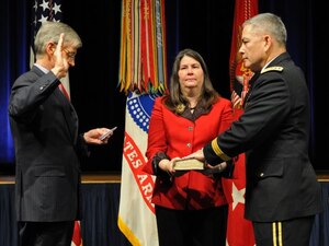 After receiving his fourth star, Gen. John F. Campbell is sworn in as the Army's 34th vice chief of staff by Secretary of the Army John McHugh, March 8, 2013. Campbell's wife, Ann, holds the Bible. Campbell succeeds Gen. Lloyd J. Austin III as the Army's vice chief of staff. (U.S. Army photo by J. D. Leipold)