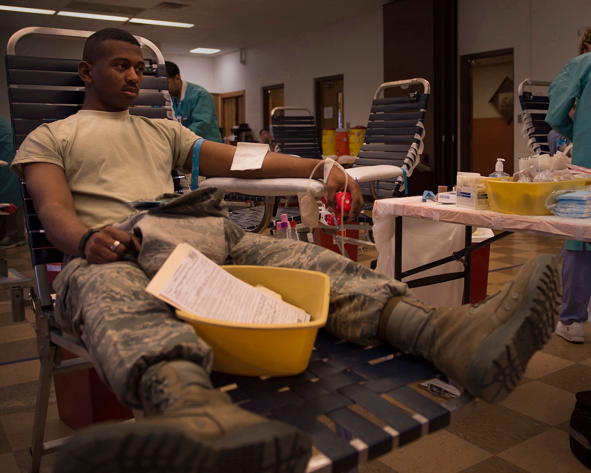 Airman 1st Class Marquis Brooks, 27th Special Operations Aircraft Maintenance Squadron crew chief donates blood to the Armed Services Blood Program blood drive at Cannon Air Force Base, N.M., March 5, 2013. The ASBP plays a key role in providing blood during emergencies for service members and their families in both peace and war. (U.S. Air Force photo/Staff Sgt. Matthew Plew)