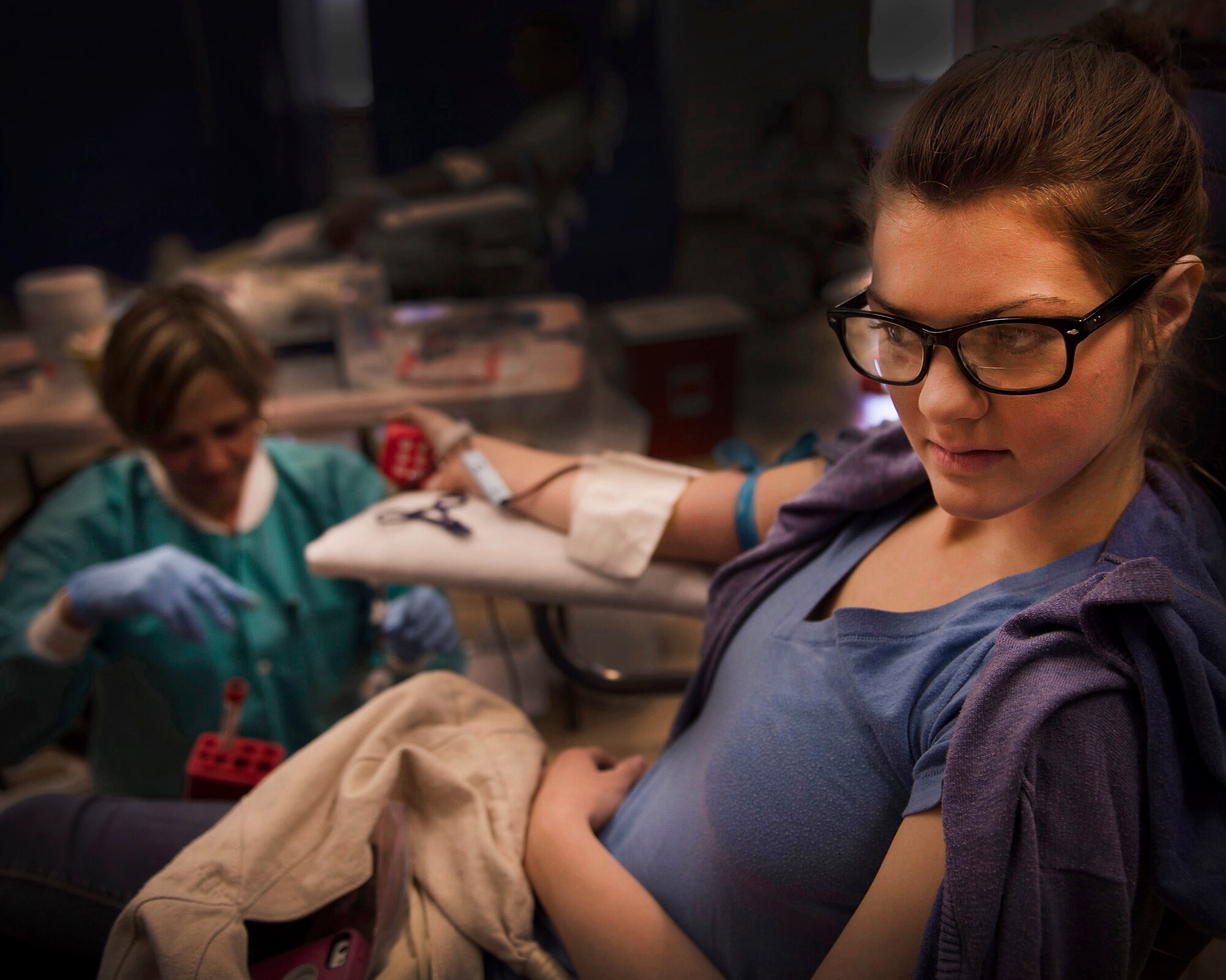 Rachel Roberts, a military spouse, donates blood to the Armed Services Blood Program blood drive at Cannon Air Force Base, N.M., March 5, 2013. The ASBP plays a key role in providing blood during emergencies for service members and their families in both peace and war. (U.S. Air Force photo/Staff Sgt. Matthew Plew)