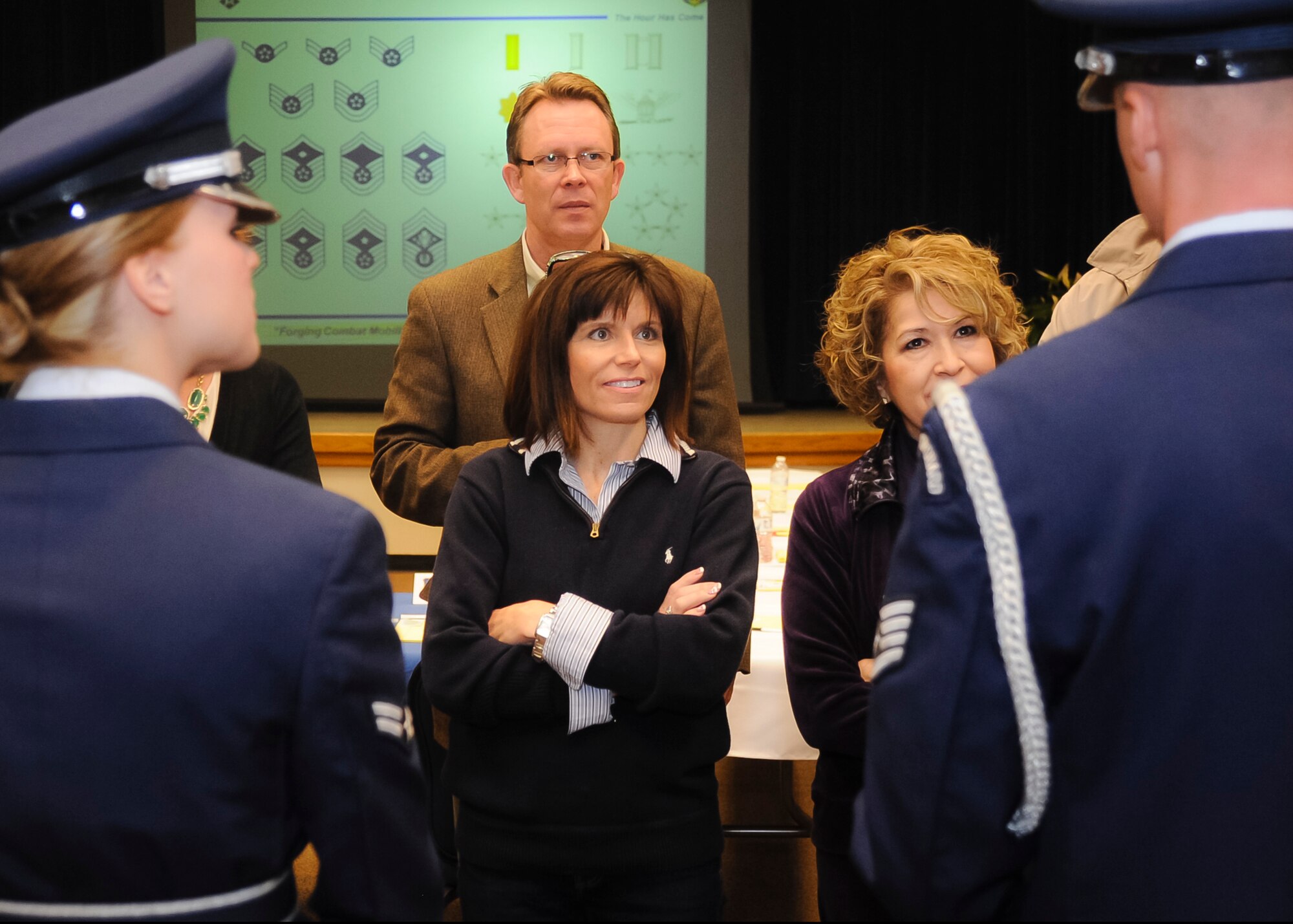 ALTUS AIR FORCE BASE, Okla. – 97th Air Mobility Wing Honorary Commanders learn about the different Air Force uniforms at the Freedom Community Center during Altus AFB’s first Honorary Commander Boot Camp, March 8. The boot camp was held to allow Honorary Commanders a chance to experience a day in the life of an Airman, and to learn about the history and traditions of the U.S. Air Force. The Honorary Commander program fosters and strengthens the friendship and partnership between the base and surrounding community.  (U.S. Air Force photo by Airman 1st Class Levin Boland / Released)