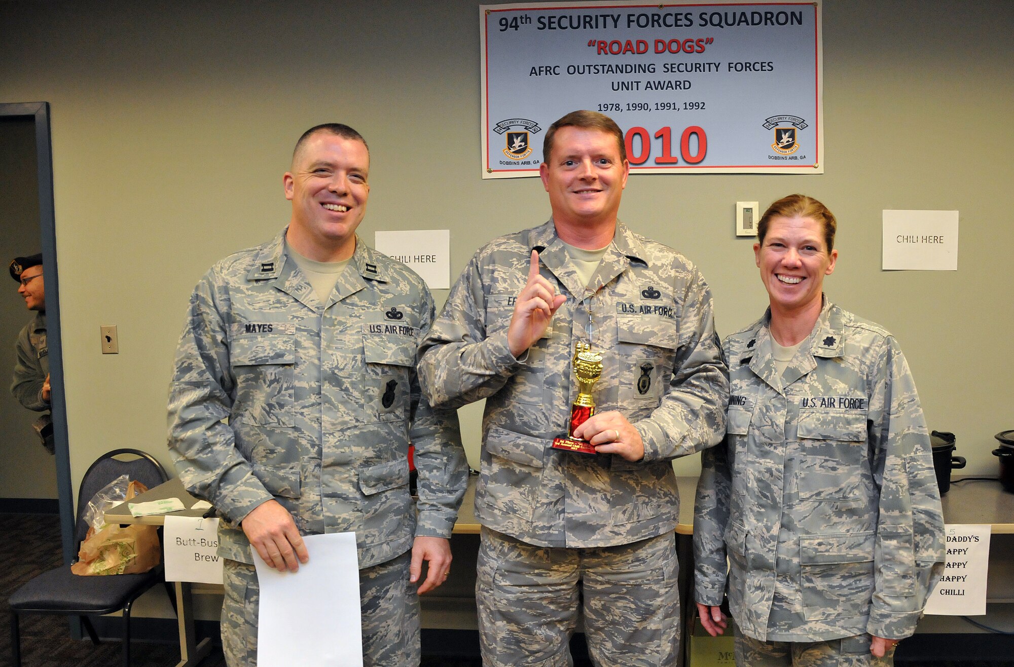 Accepting first place on behalf of Master Sgt. Scott Laflamme with his “Tora! Tora! Tora!” chili, Senior Master Sgt. Rocky Epps, of the 94th Security Forces Squadron, is speechless. The Third Annual 94th SFS Chili Cook-off was guarded against tampering at the 94th SFS building on Dec. 12. (U.S. Air Force photo/Senior Airman Elizabeth Van Patten)