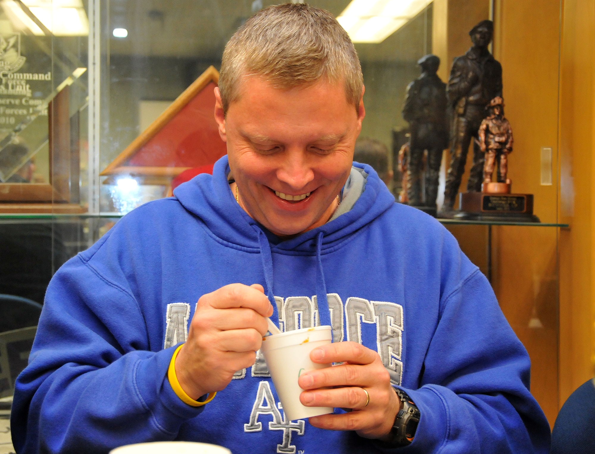 First-time judge, John Mikula, 94th AW exercise physiologist, recommends chili as a recovery meal following a workout. The Third Annual 94th Security Forces Squadron Chili Cook-off was guarded against tampering at the 94th SFS building on Dec. 12. (U.S. Air Force photo/Senior Airman Elizabeth Van Patten)