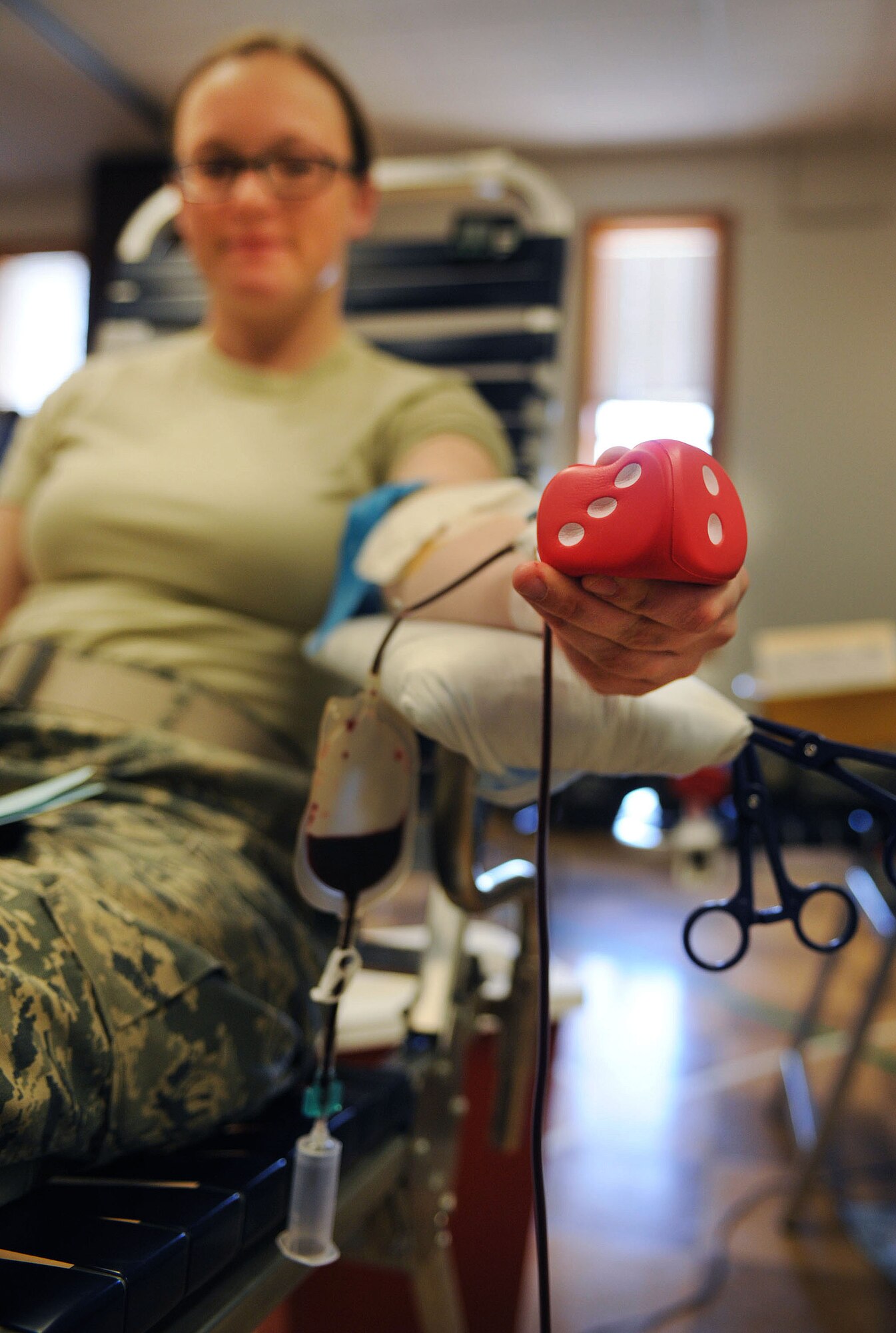 A volunteer donates blood to the Armed Services Blood Program blood drive at Cannon Air Force Base, N.M., March 5, 2013. The ASBP plans to return each quarter to Cannon to host future blood drives. (U.S. Air Force photo/Airman 1st Class Ericka Engblom)