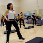 Claudia Peacock, step instructor at the Rambler Fitness Center, conducts a motivational step class Feb. 15 at Joint Base San Antonio-Randolph.  (U.S. Air Force photo by Don Lindsey)