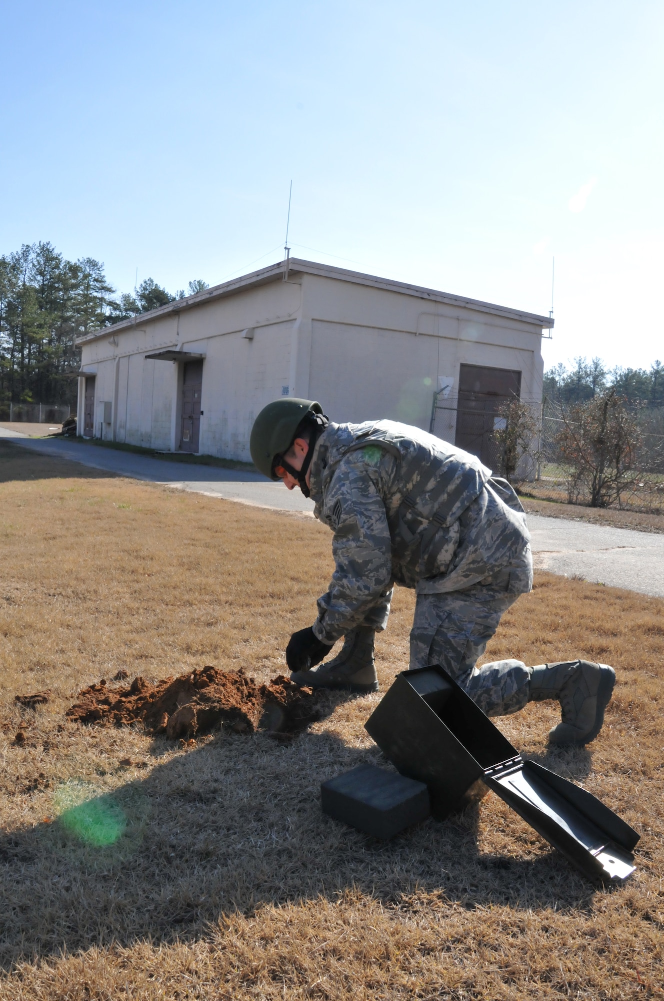 A hole is dug and the grenade is inserted in it. The ordnance is buried to mitigate fragmentation during detonation. Members of the 94th Explosive Ordnance Disposal Flight simulate various scenarios to ensure the safety of the base from explosive hazards. The team is also regularly called out to off base locations within the Southeast to dispose of military explosive devices. Since EOD Airmen only get one chance to disarm ordnance they encounter, they rely a great deal on the training they receive. (U.S. Air Force photo/Senior Airman Elizabeth Van Patten)