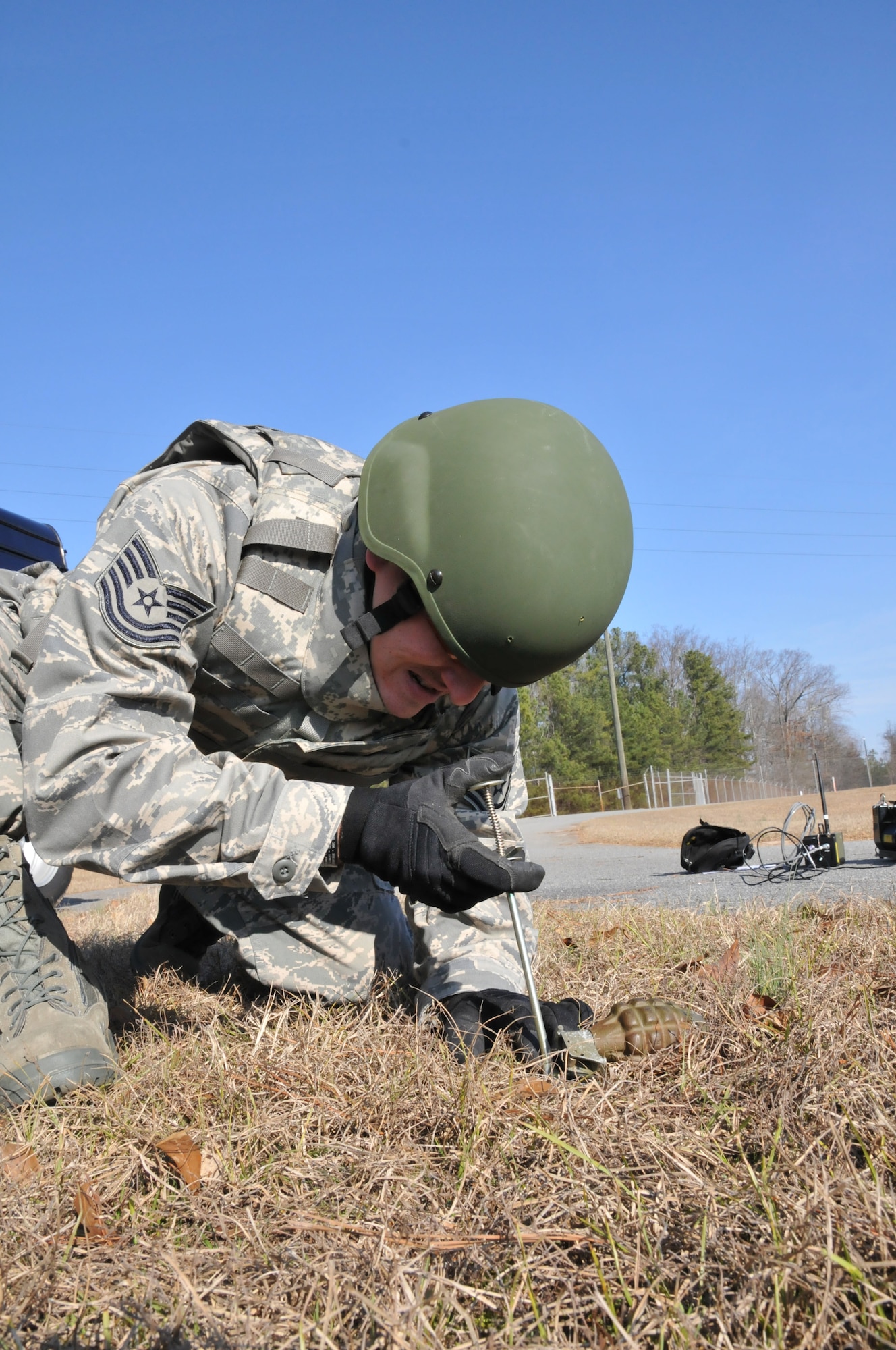 Swann uses a caliper to measure the diameter of the grenade. Once nomenclature is established, it is prepared for detonation. (U.S. Air Force photo/Senior Airman Elizabeth Van Patten)