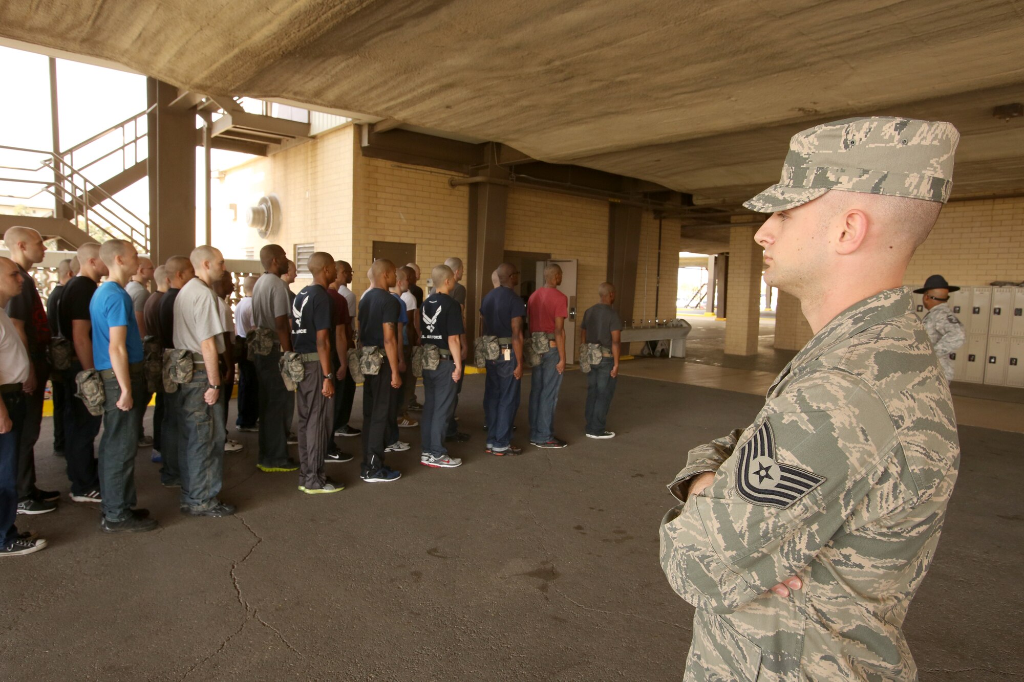 Tech. Sgt. Joshua Sharp observes Air Force basic training at JBSA-Lackland. He shadowed Military Training Instructors for three days, getting a first-hand experience of the program, so that he could decide whether he wants to become an instructor. (U.S. Air Force photo by Robbin Cresswell/Released)