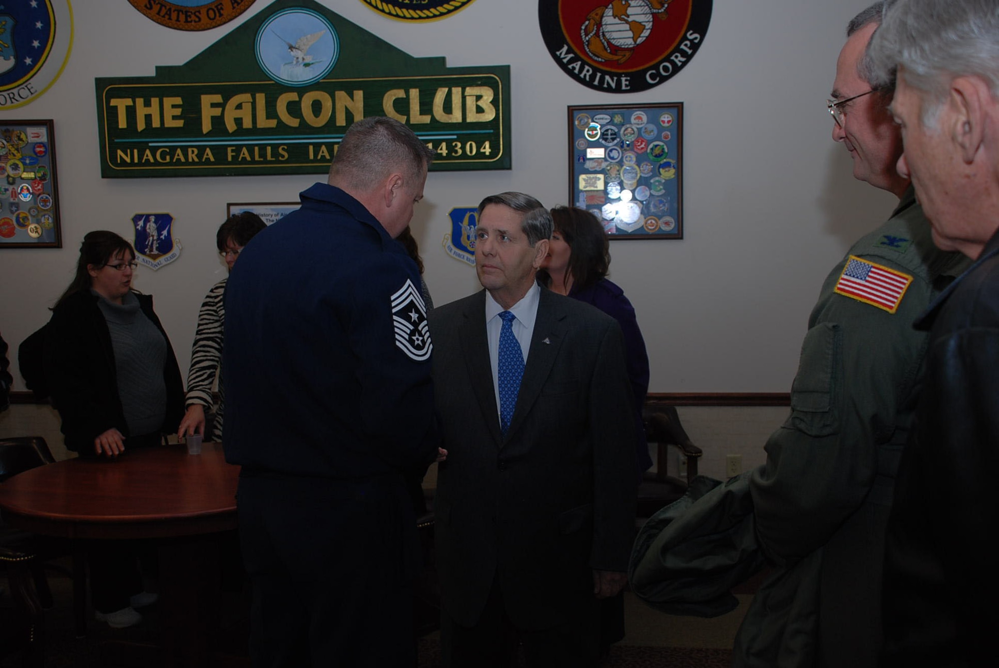 Members of the 107th Airlift Wing congratulate Mr. Merrell Lane, chairman of 
the Niagara Military Affairs Council on his receipt of the New York State 
Conspicuous Service Medal.(Air National Guard Photo/Senior Airman Daniel Fravel)
