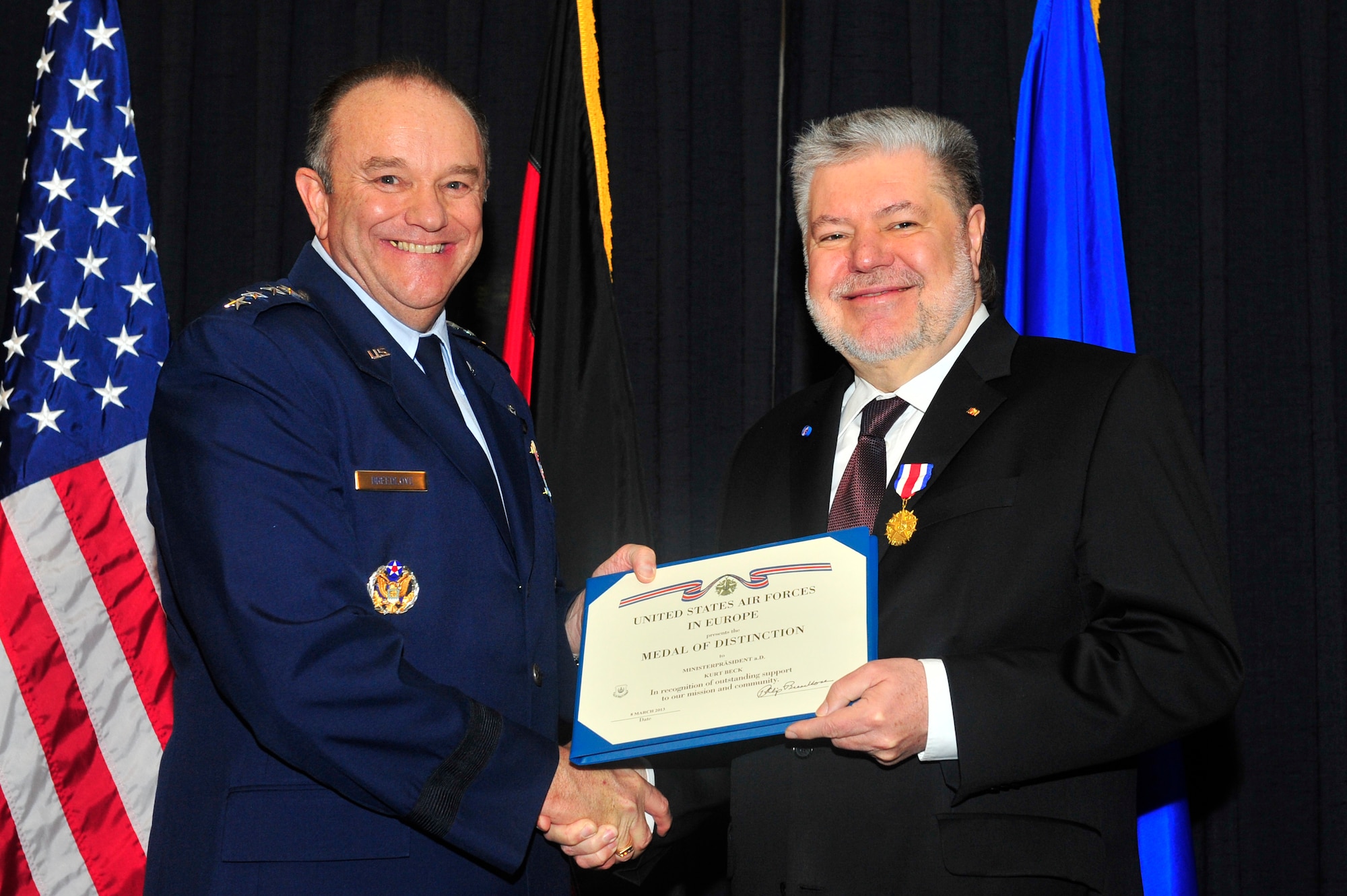 Gen. Philip M. Breedlove, United States Air Forces in Europe and Air Forces Africa commander, presents former Minister President Kurt Beck the U.S. Air Forces in Europe Medal of Distinction on Ramstein Air Base, Germany, March 8, 2013.  The USAFE Medal of Distinction is awarded to non-U.S. citizens in recognition of extraordinary service, achievements, or support to the accomplishment of the mission of USAFE. (U.S. Air Force photo/Senior Airman Aaron-Forrest Wainwright)