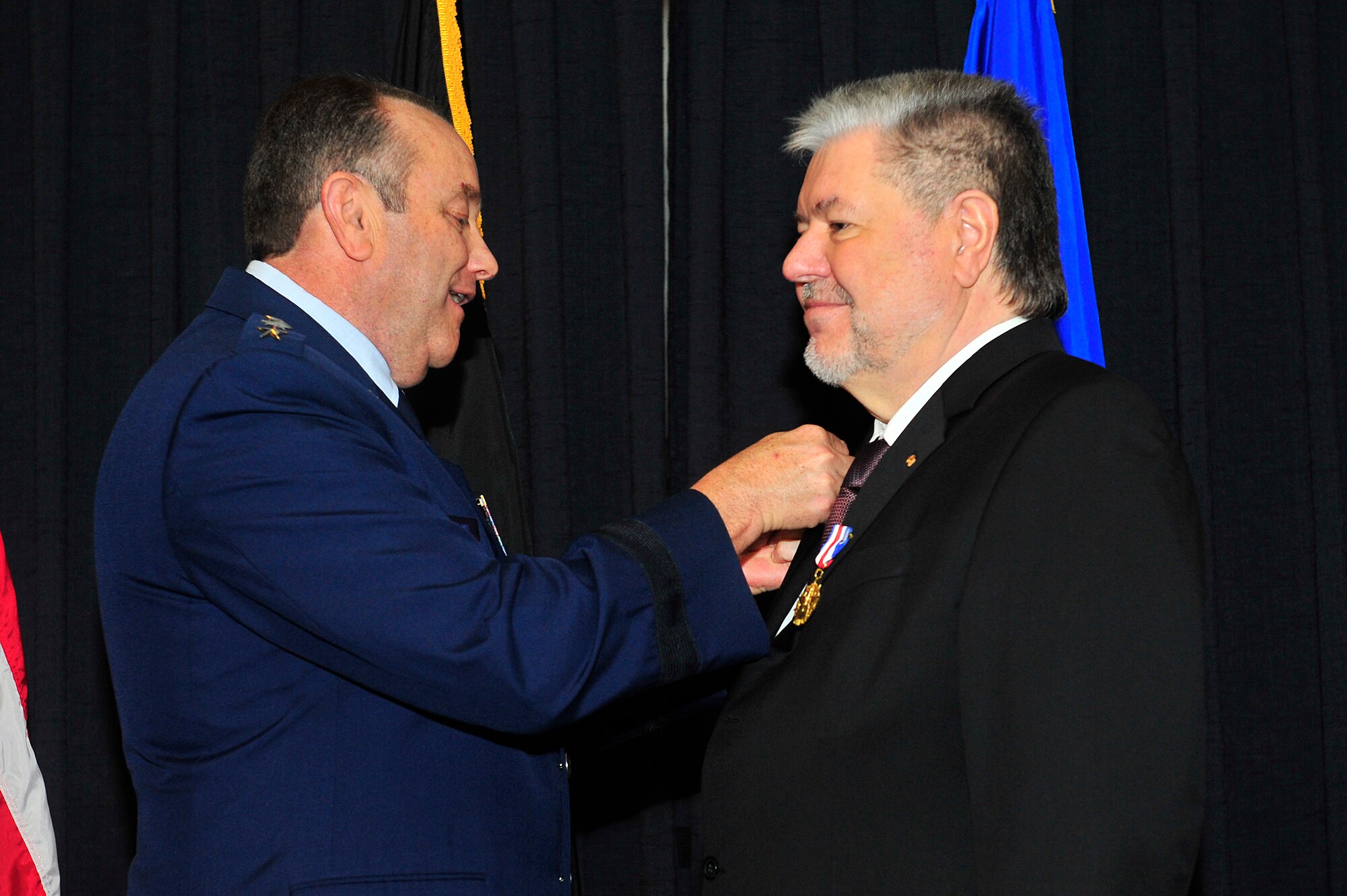 Gen. Philip M. Breedlove, United States Air Forces in Europe and Air Forces Africa commander, presents former Minister President Kurt Beck the U.S. Air Forces in Europe Medal of Distinction on Ramstein Air Base, Germany, March 8, 2013.  The USAFE Medal of Distinction is awarded to non-U.S. citizens in recognition of extraordinary service, achievements, or support to the accomplishment of the mission of USAFE. (U.S. Air Force photo/Senior Airman Aaron-Forrest Wainwright)