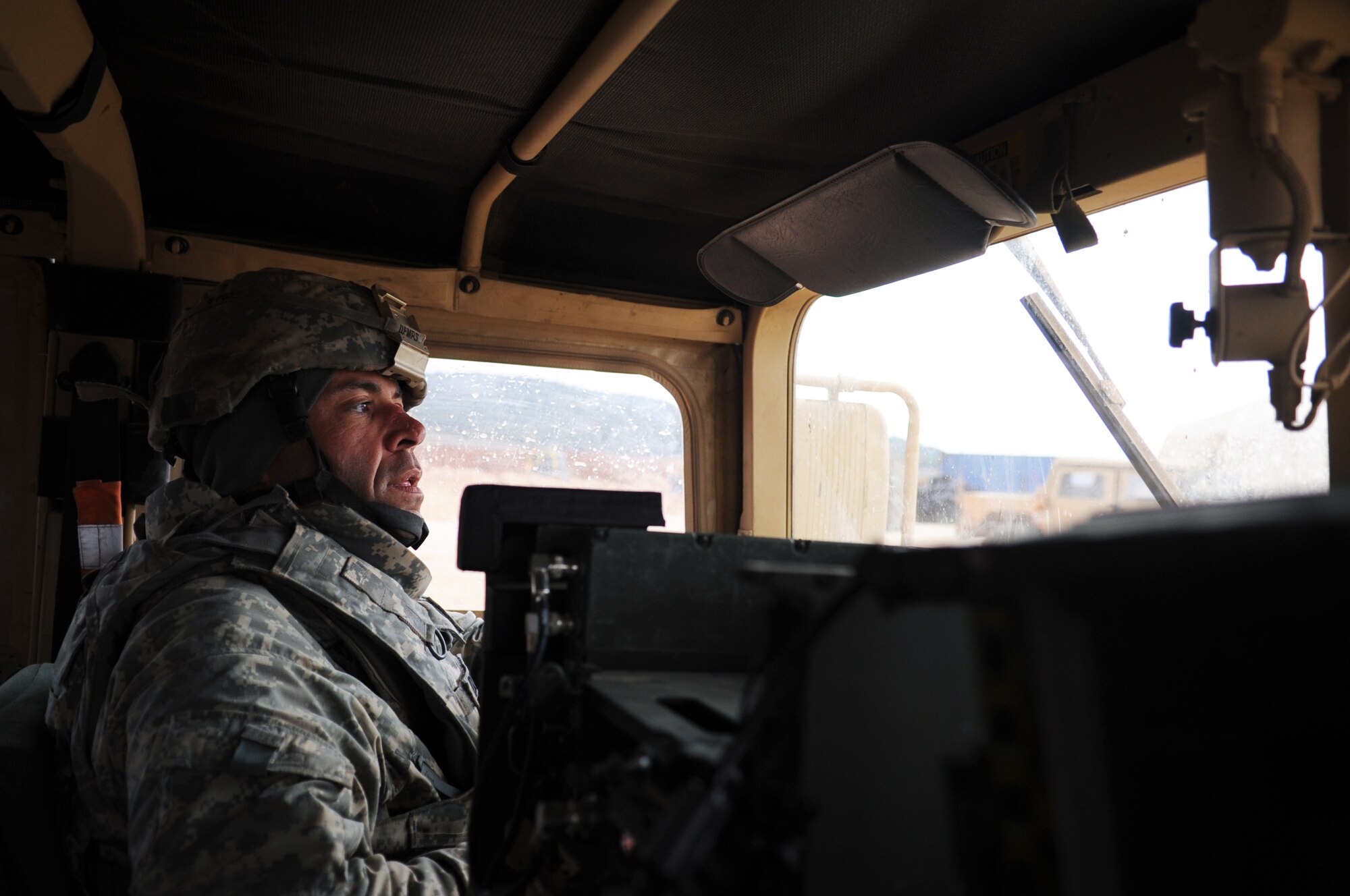 U.S. Army Sgt. 1st Class Mike Demps, 3rd Battalion, 2nd Air Defense Artillery NCO in charge of Charlie company, drives to check on the status of his soldiers Feb. 28, 2013, near Gaziantep, Turkey. The 3-2 ADA from Fort Sill, Okla. is deployed to Turkey as part of the NATO effort for a cooperative solution to promote regional stability and augment Turkey’s air defense capabilities. (U.S. Air Force photo by Senior Airman Daniel Phelps/Released)