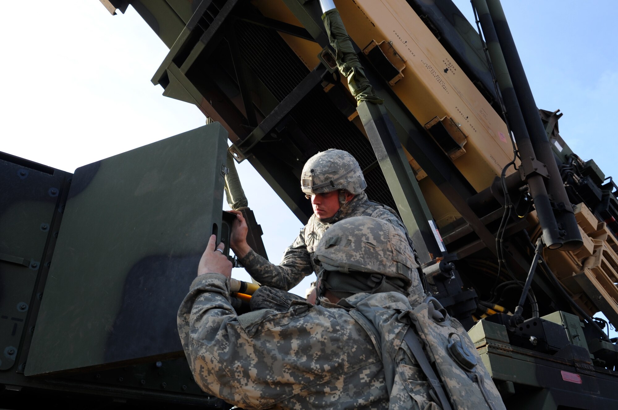 U.S. Army Spc. Charles Chesbro and U.S. Army Sgt. Zachary Perez, both 3rd Battalion, 2nd Air Defense Artillery maintainers, inspect the settings on a Patriot launching station Feb. 28, 2013, near Gaziantep, Turkey. U.S. Army Patriots from Fort Sill, Okla. are deployed to Turkey as part of a precautionary defensive measure undertaken in accordance with NATO’s standing defense plan. (U.S. Air Force photo by Senior Airman Daniel Phelps/Released)