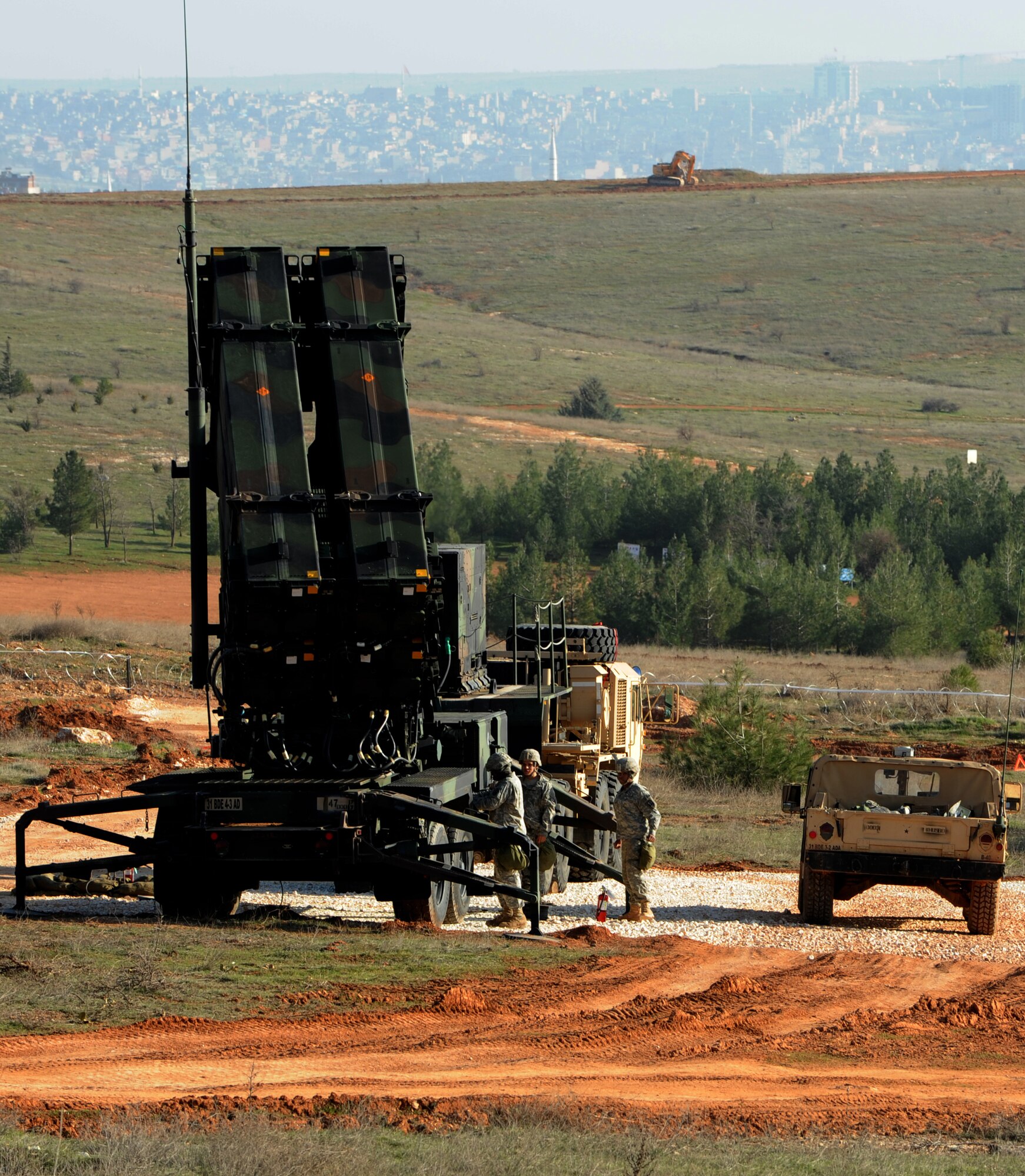 U.S. Army soldiers from the 3rd Battalion, 2nd Air Defense Artillery check the settings of a Patriot launching station Feb. 28, 2013, near Gaziantep, Turkey. The 3-2 ADA from Fort Sill, Okla. is deployed to Turkey as part of NATO’s effort for a cooperative solution to promote regional stability and augment Turkey’s air defense capabilities. (U.S. Air Force photo by Senior Airman Daniel Phelps/Released)