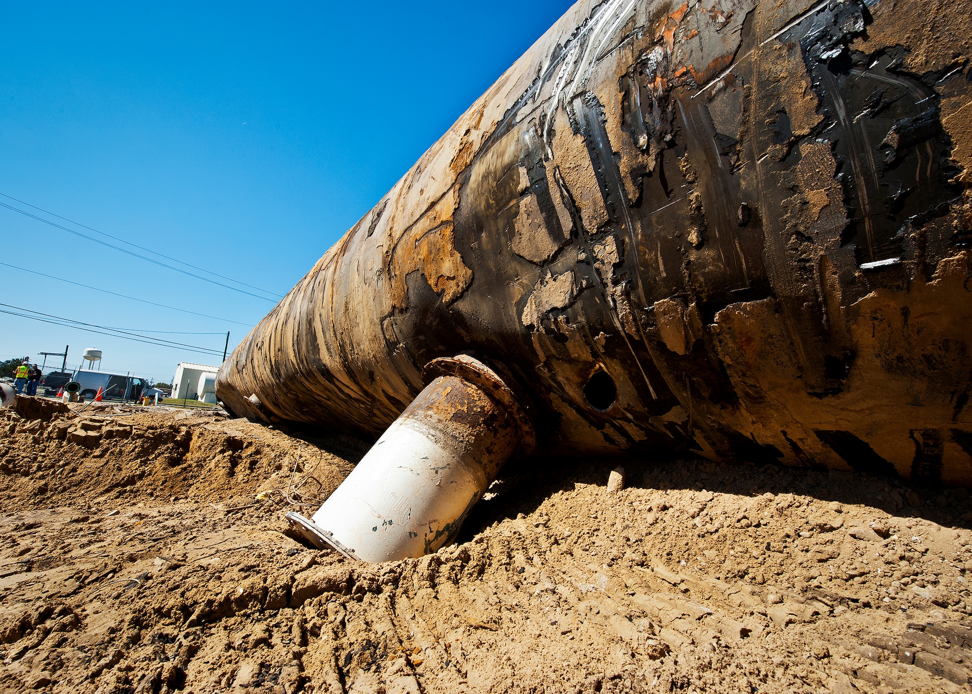 A 50,000 gallon underground fuel storage tank sits in the sun after being removed from the ground near the 33rd Fighter Wing March 11 at Eglin Air Force Base, Fla.  The tank was one of four removed from the area.  The systems have been in place since 1959 and formerly used to refuel 33rd FW aircraft until recently.  The new fuel storage system is already in place and increases the wing's capacity to more than a million gallons of JP-8 for the F-35s.  (U.S. Air Force photo/Samuel King Jr.)