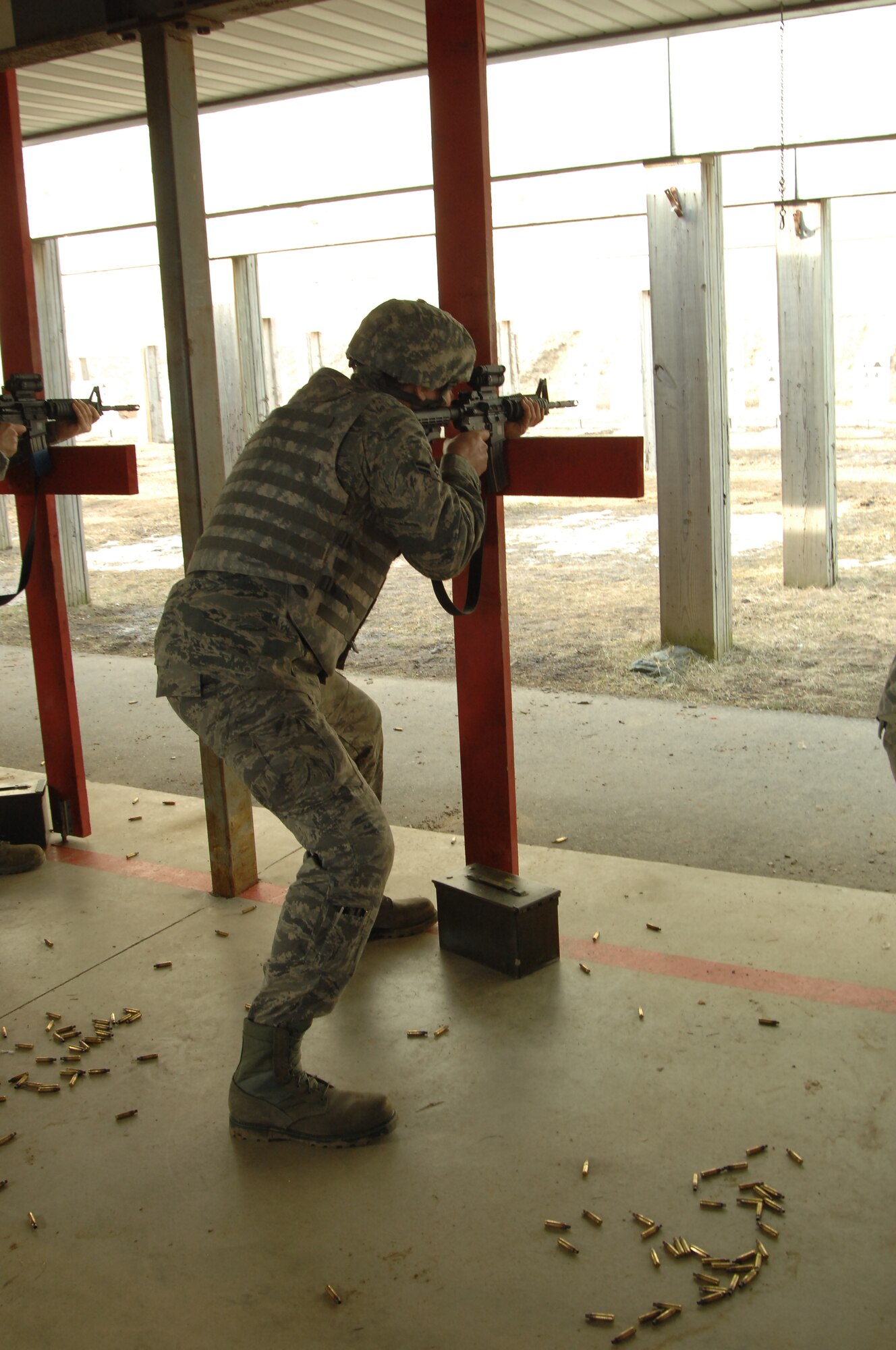A 127th Wing Airman fires the M-4 rifle at the Selfridge Combat Arms Training and Maintenance range at Selfridge Air National Guard Base, Mich., March 9, 2013. Airmen receive weapons training on a variety of schedules, depending on their duty classification. (Air National Guard photo by SSgt. Samara Taylor)