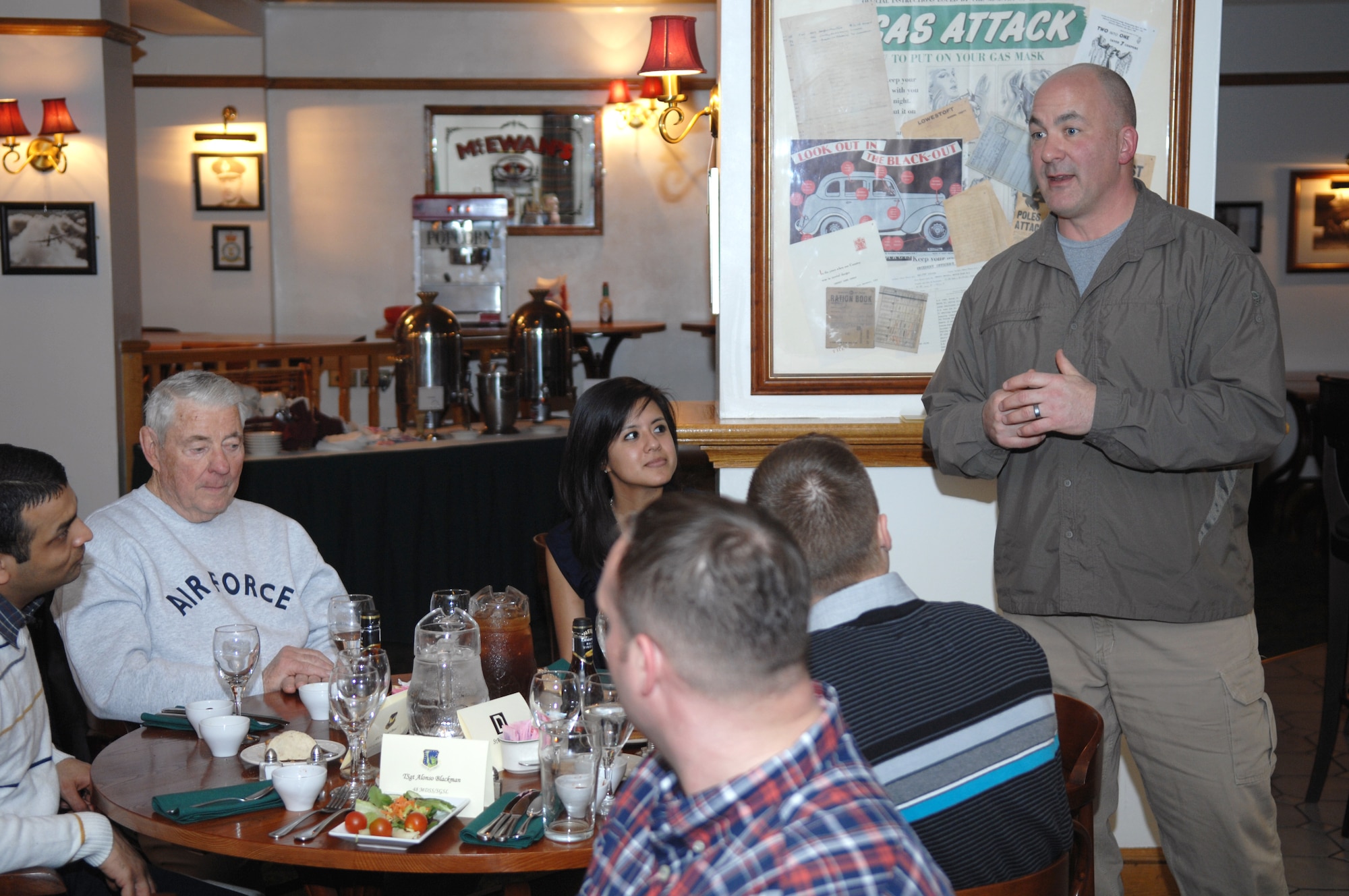 Chief Master Sgt. William Markham, 352nd Special Operations Group command chief, speaks to a group of Airmen from RAF Mildenhall and RAF Lakenheath, England, during a dinner held for retired Chief Master Sgt. of the Air Force Bob Gaylor, fifth CMSAF from San Antonio, Texas, March 7, 2013, at Middleton Hall on RAF Mildenhall, England. Gaylor first visited RAF Mildenhall 42 years ago, and has returned more than 40 times. (U.S. Air Force photo by Airman 1st Class Dillon Johnston/Released)