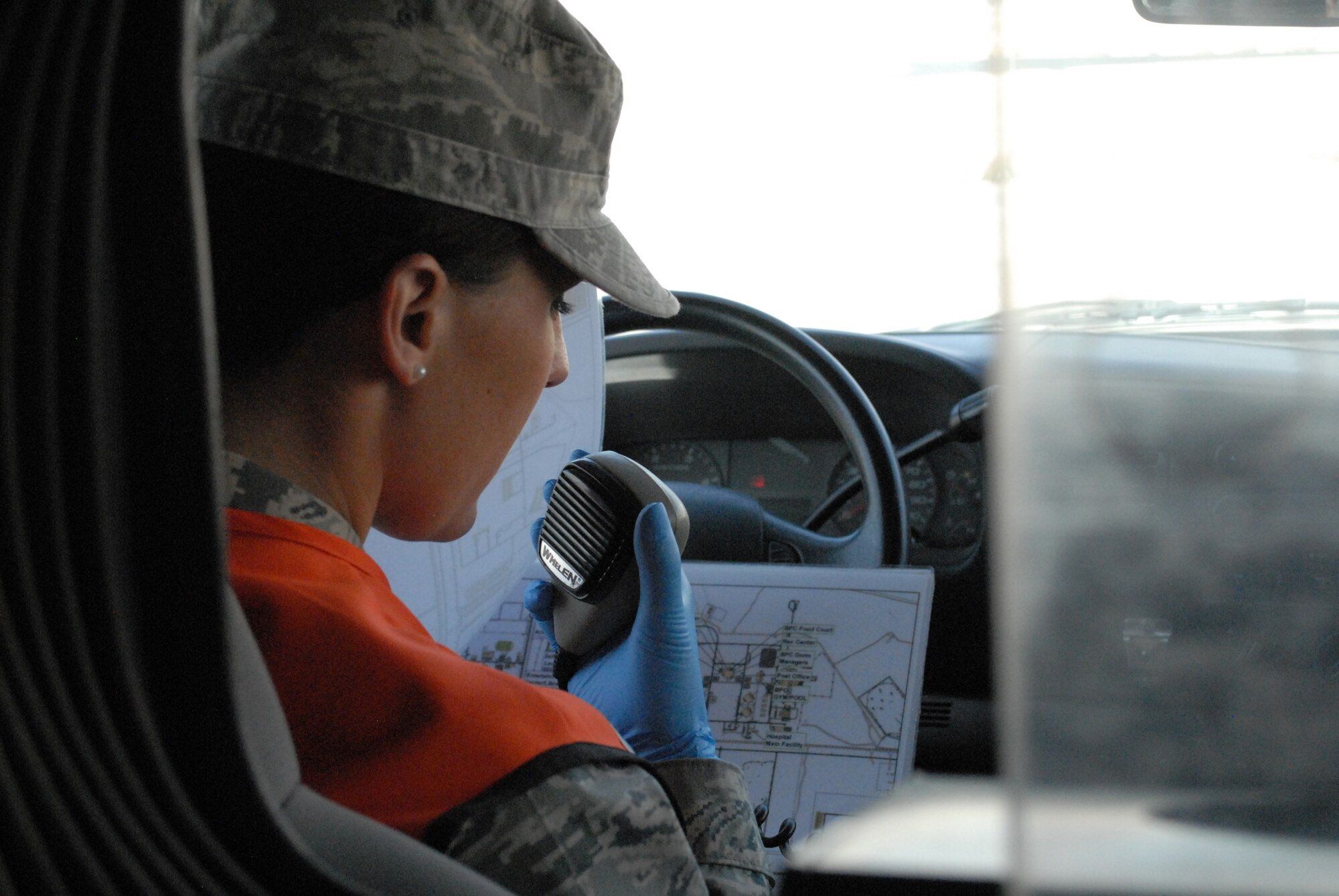 Senior Airman Sonni Hamill, medical technician, radio’s ahead to notify emergency room staff of inbound patient transport, Mar. 8. The 379th Expeditionary Medical Group serves all the emergency and transient medical needs for the 379th Air Expeditionary Wing and tenant units. (U.S. Air Force photo/Master Sgt. Christian Michael)