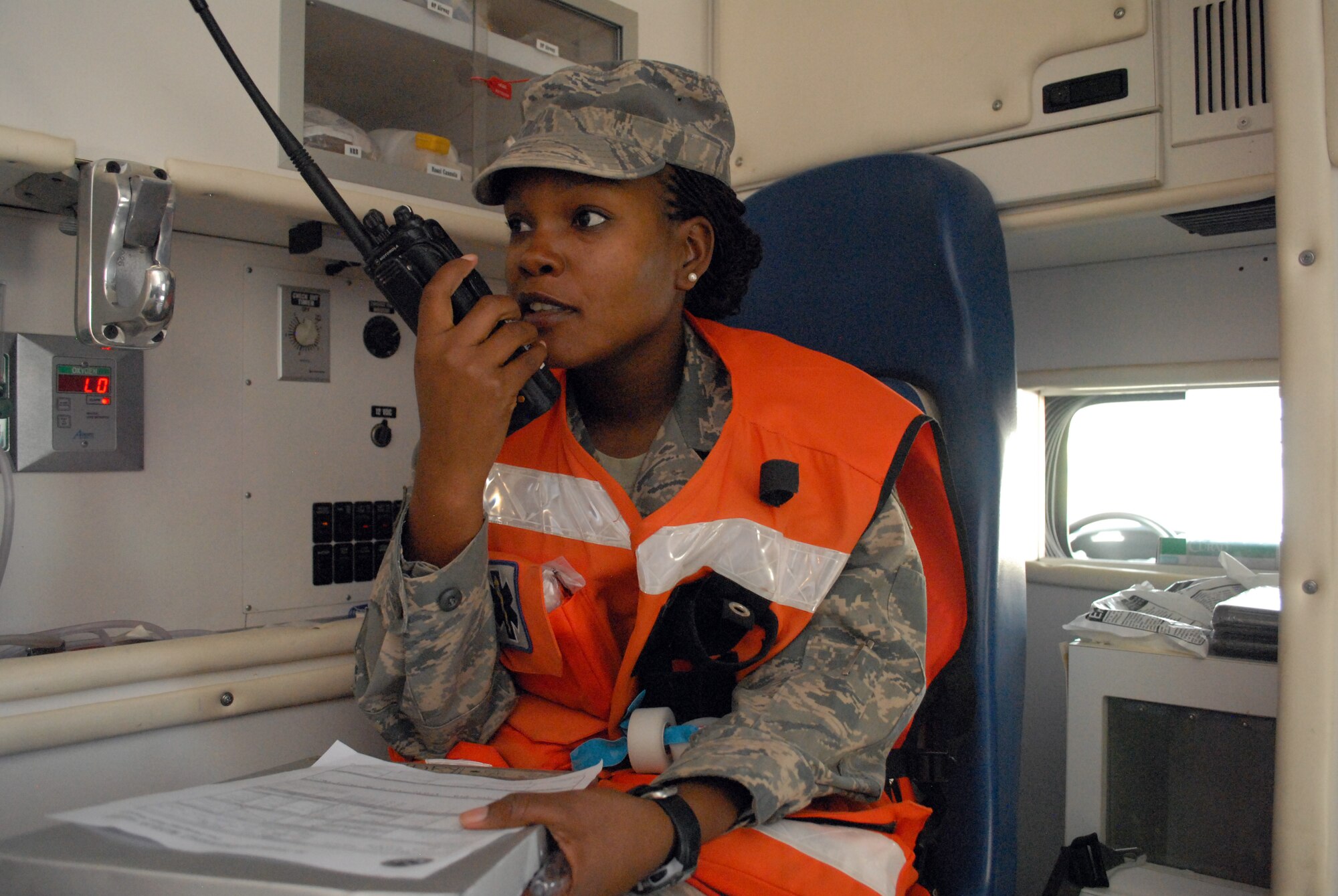 Senior Airman Diana Ceus, medical technician, reports a patient's pertinent information to emergency personnel at the base medical clinic, Mar. 8. The 379th Expeditionary Medical Group serves all the emergency and transient medical needs for the 379th Air Expeditionary Wing and tenant units. (U.S. Air Force photo/Master Sgt. Christian Michael)