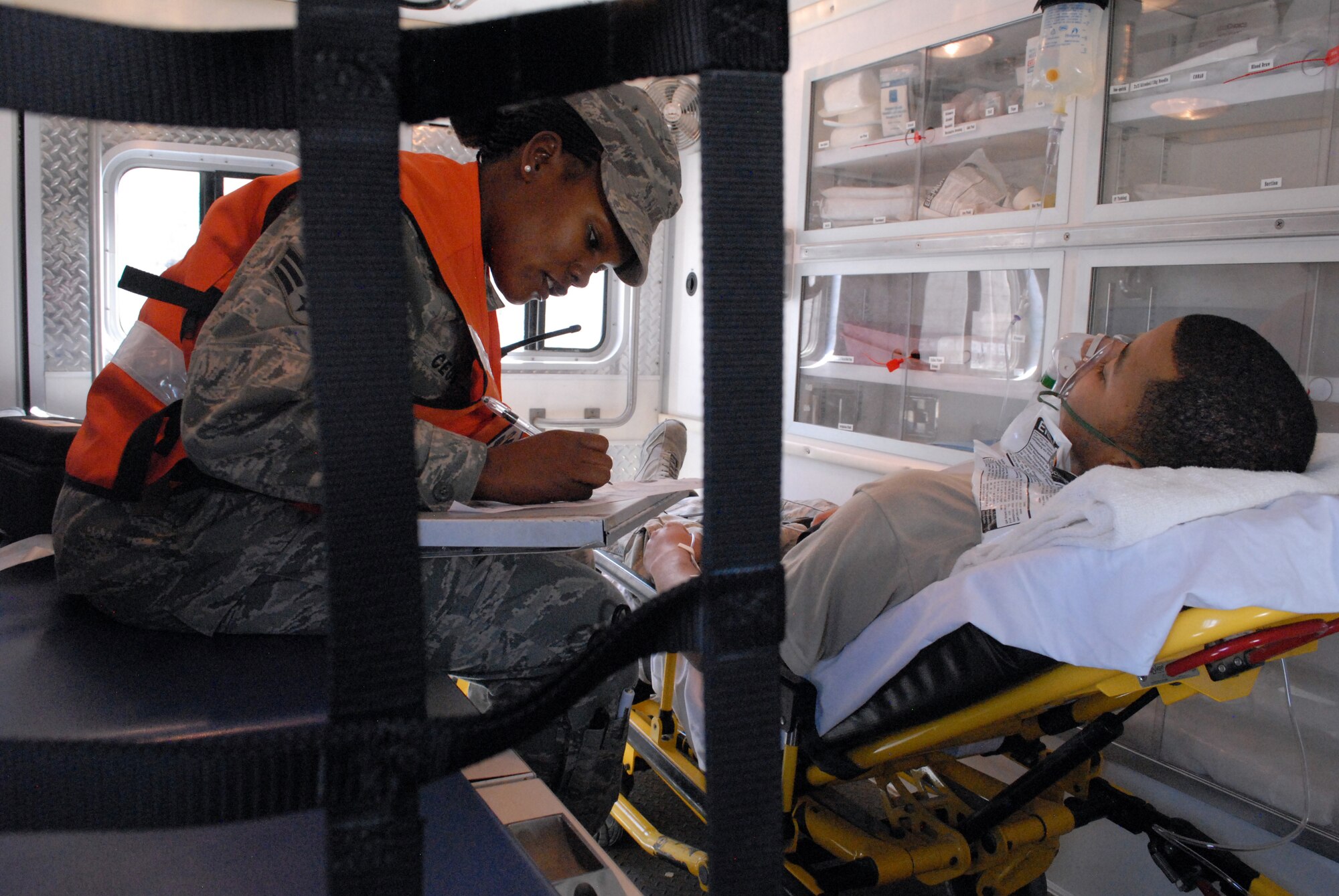 Senior Airman Diana Ceus, medical technician, records a patient's pertinent information before transport to the base medical clinic, Mar. 8. The 379th Expeditionary Medical Group serves all the emergency and transient medical needs for the 379th Air Expeditionary Wing and tenant units. (U.S. Air Force photo/Master Sgt. Christian Michael)