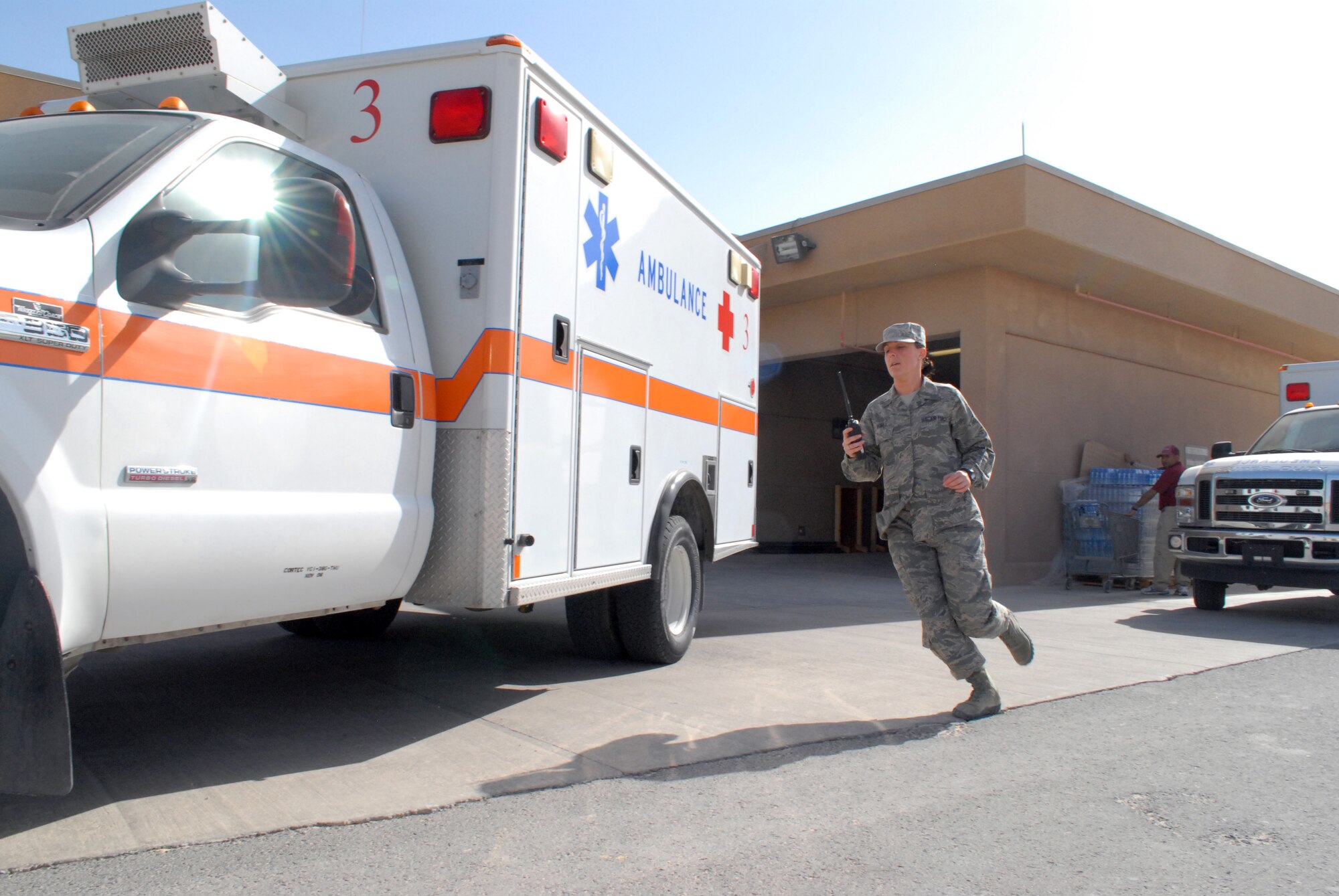 Senior Airman Sonni Hamill, medical technician, runs to an ambulance to respond to a medical emergency, Mar. 8. The 379th Expeditionary Medical Group serves all the emergency and transient medical needs for the 379th Air Expeditionary Wing and tenant units. (U.S. Air Force photo/Master Sgt. Christian Michael)