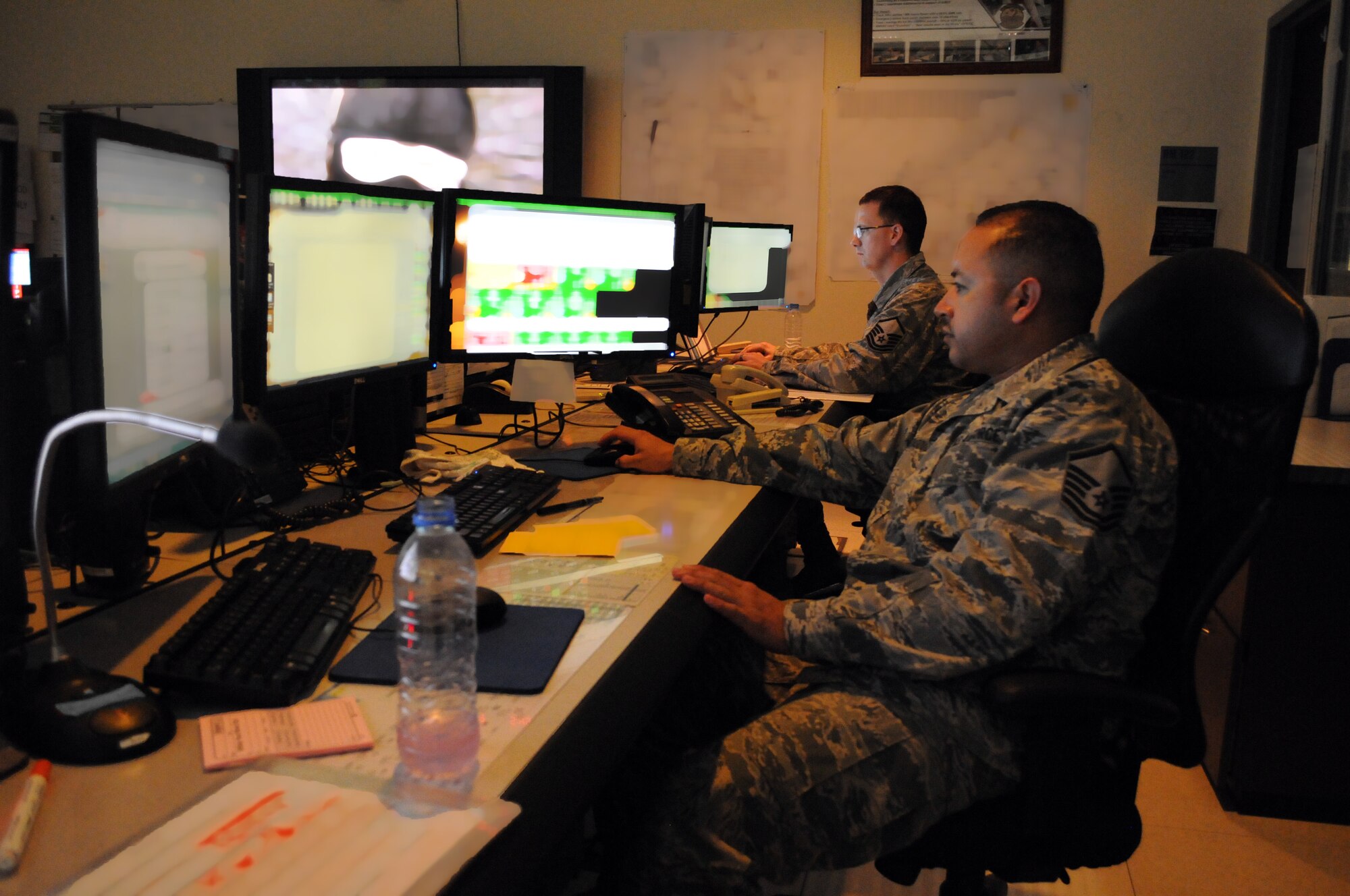 Senior maintenance operations center senior controller Master Sgt. Daniel Velasquez coordinates maintenance scheduling among five deployed airframes, Mar. 7. The 379th Expeditionary Maintenance Group MOC manages all maintenance operations for units assigned to the 379th Air Expeditionary Wing, ranging from scheduling maintenance, preventing loss of covering by staggering non-maintenance activities, and upchanneling important information to appropriate leadership to make informed operational decisions. (U.S. Air Force photo/Master Sgt. Christian Michael)