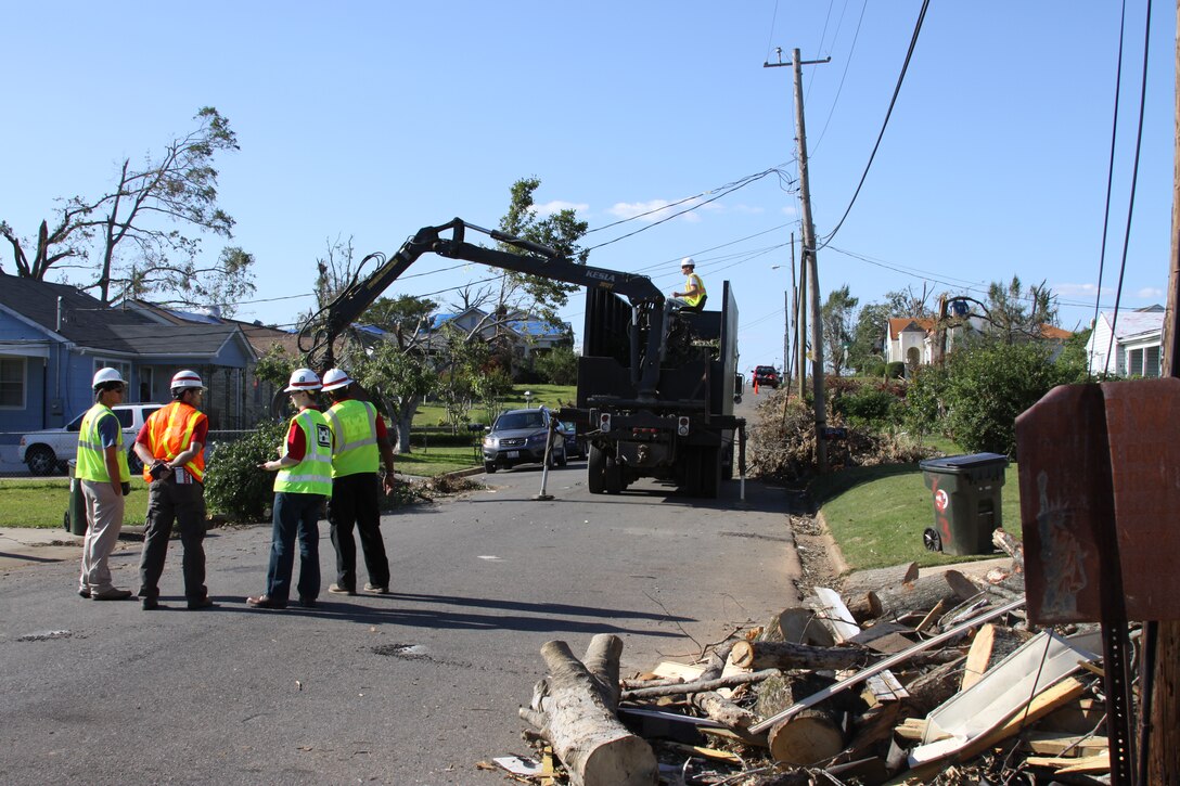 Members of the U.S. Army Corps of Engineers work on debris management during federal clean-up efforts following a series of tornadoes and severe storms that struck portions of Alabama in April 2011. The Corps works under the direction of FEMA to provide engineering and public works support following a natural disaster.