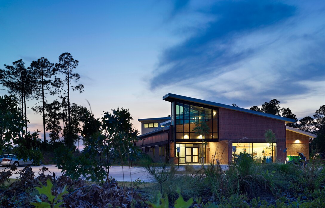 This $2.6 million Community Emergency Services Station at Fort Bragg, N.C., is the first LEED Platinum facility of its type in the Army. LEED refers to the Leadership in Energy and Environmental Design rating system, which involves the use of environmentally sustainable building and design practices. At 8,300 square-feet, the facility includes mechanisms that save 35 percent more energy than a typical building of its kind. Features include geothermal heat pumps, a solar hot water heating system, a rainwater collection system for washing fire engines and flushing toilets, use of local suppliers, and energy efficient fixtures and lighting. The project was completed by the U.S. Army Corps of Engineers Savannah District in March 2011 and received a LEED Platinum certification (the highest level) in 2012 from the Green Building Certification Institute.