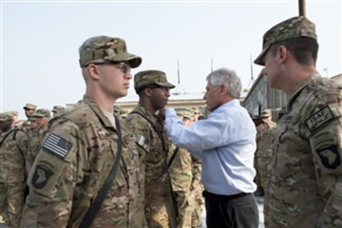 Secretary of Defense Chuck Hagel awards a Purple Heart to a soldier during a ceremony in Jalalabad, Afghanistan, on March 9, 2013.  Hagel is in Afghanistan on his first trip as secretary of defense to visit U.S. troops, NATO leaders, and Afghan counterparts.  