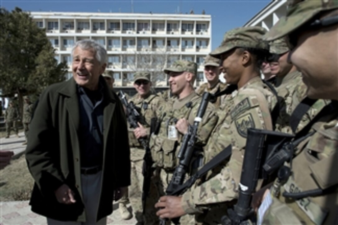 Secretary of Defense Chuck Hagel laughs with American service members while visiting the Kabul Military Training Center, in Kabul, Afghanistan, on March 10, 2013. Hagel is in Afghanistan on his first trip as secretary of defense to visit U.S. troops, NATO leaders, and Afghan counterparts.  