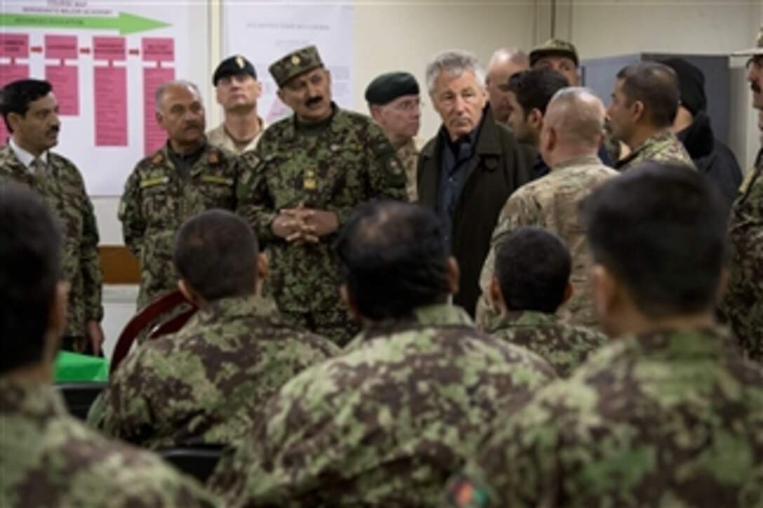 Secretary of Defense Chuck Hagel, third from right, is shown a class room for Afghan soldiers by Afghan Brig. Gen. Aminullah Patyani, commander, Kabul Military Training Center, in Kabul, Afghanistan, on March 10, 2013.  Hagel is in Afghanistan on his first trip as secretary of defense to visit U.S. troops, NATO leaders, and Afghan counterparts.  