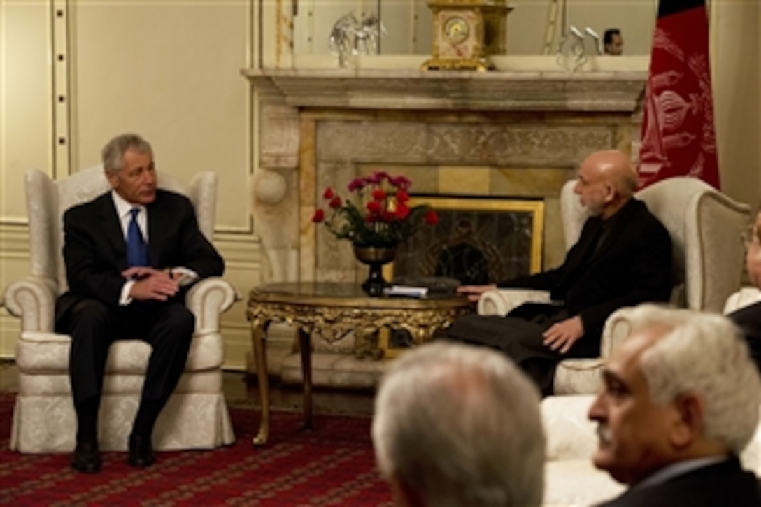 Secretary of Defense Chuck Hagel, left, meets with President of Afghanistan Hamid Karzai, right, in Kabul, Afghanistan, on March 10, 2013.  Hagel is in Afghanistan on his first trip as secretary of defense to visit U.S. troops, NATO leaders, and Afghan counterparts.  