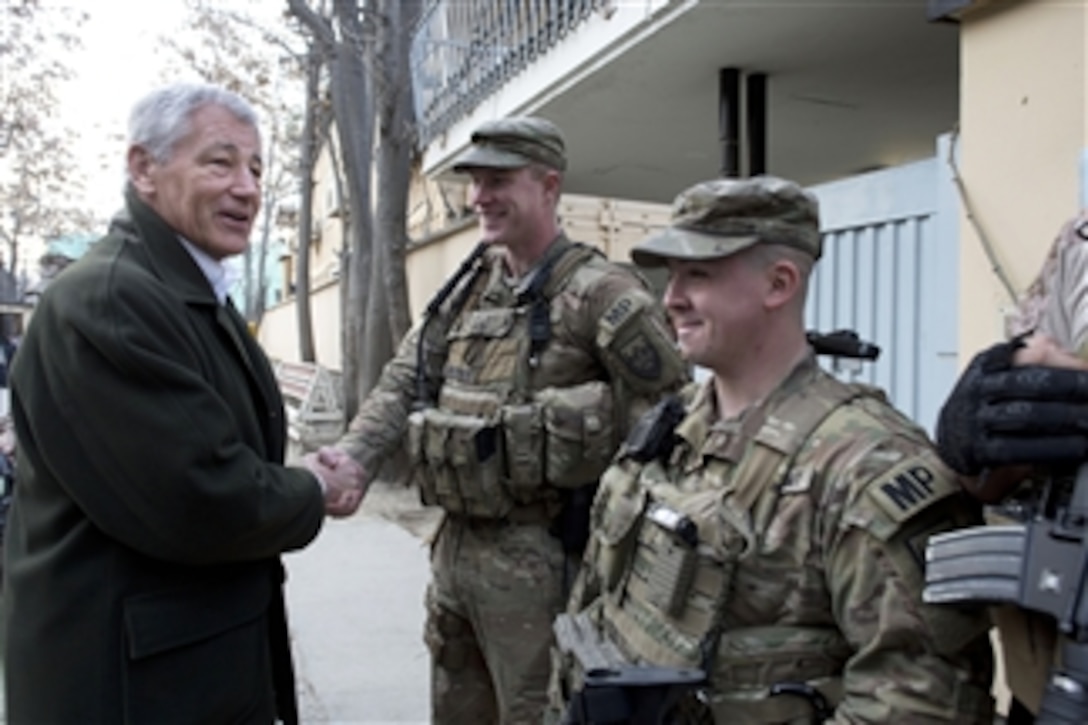 Secretary of Defense Chuck Hagel shakes hands with U.S. Army military policemen as he thanks them for their support during his trip to Kabul, Afghanistan, on March 11, 2013.  Hagel is in Afghanistan on his first trip as secretary of defense to visit U.S. troops, NATO leaders, and Afghan counterparts.  