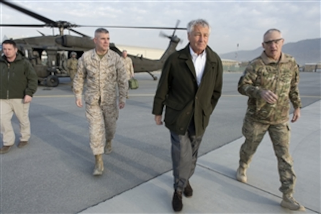Secretary of Defense Chuck Hagel, center, walks with Commander, ISAF Joint Command, Lt. Gen. James Terry, (right) and Deputy Chief of Staff, ISAF Joint Command, Maj. Gen. Joseph Osterman, (left), before departing Kabul, Afghanistan, on March 11, 2013.  Hagel is in Afghanistan on his first trip as secretary of defense to visit U.S. troops, NATO leaders, and Afghan counterparts.  
