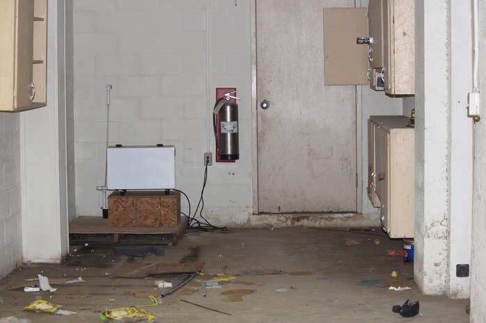 A photo depicts the storage area at the USO in Jacksonville, N.C., before a refurbishing effort launched by servicemembers with Medical Logistics Company, 2nd Supply Battalion, 2nd Marine Logistics Group January 2013. A group of servicemembers from the company volunteered to update the USO’s storage area after the battalion donated more than 6,000 pounds of nonperishable food items. 