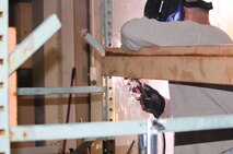 A servicemember with 2nd Supply Battalion, 2nd Marine Logistics Group welds together a shelving unit in the storage area at the USO in Jacksonville, N.C., during a remodeling effort launched in January. Volunteers from the unit spent several weeks updating the facility’s food-storage area to accommodate  more than 6,000 pounds of supplies donated during the battalion’s food drive.  