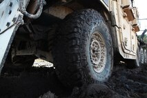 A Humvee tire rests in a field of mud during a field exercise conducted by Combat Logistics Battalion 6, 2nd Marine Logistics Group aboard Camp Lejeune, N.C., Feb. 28, 2013. The Humvee served as the last vehicle in a convoy launched to support a helicopter support team conducting operations at the base. 