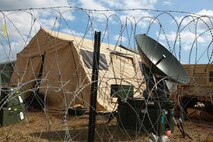 Barbed wire surrounds the command operations center for Combat Logistics Battalion 6, 2nd Marine Logistics Group during a week-long field exercise aboard Camp Lejeune, N.C., Feb. 28, 2013. The battalion conducted the exercise to prepare for its upcoming deployment to Afghanistan. 