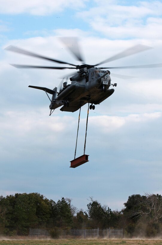 A CH-53E Super Stallion takes off with a simulated cargo load during a training exercise held as part of a field exercise conducted by Combat Logistics Battalion 6, 2nd Marine Logistics Group aboard Camp Lejeune, N.C., Feb. 28, 2013. A convoy of nine vehicles from the battalion’s main staging area took part in the event, which was designed to introduce the basics of helicopter support missions to some of the unit’s personnel. 
