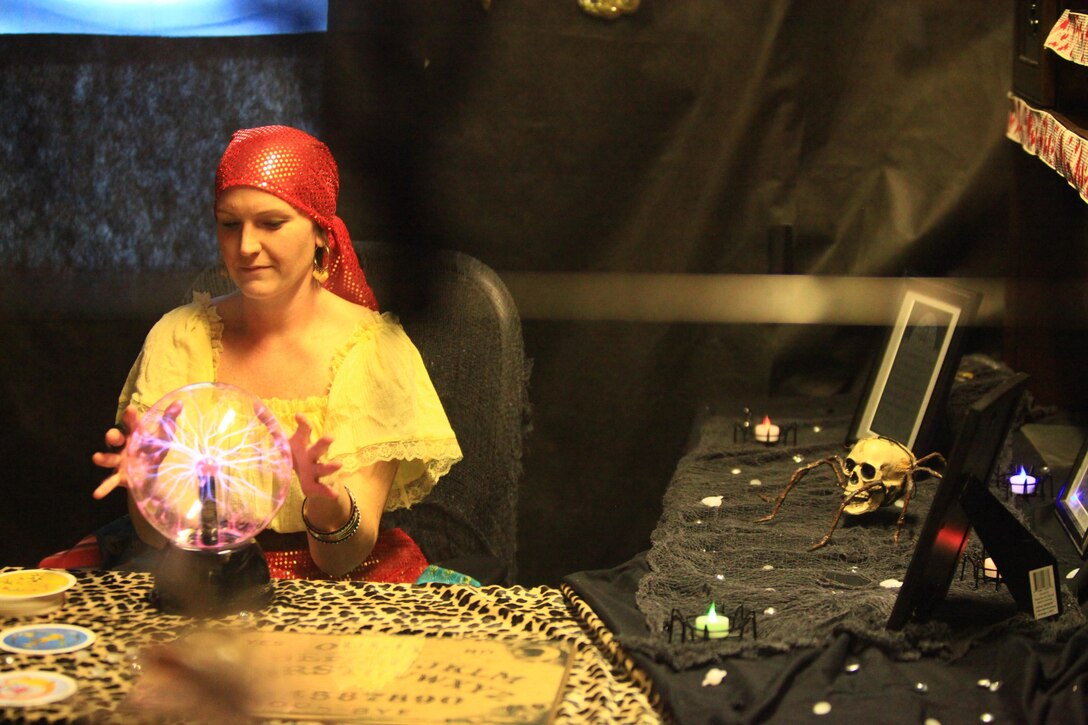 Riley A. Flynn, a volunteer with Combat Logistics Regiment 27, 2nd Marine Logistics Group, dresses as a fortune teller at the unit’s haunted house aboard Camp Lejeune, N.C., Oct. 21, 2012. Volunteers and servicemembers with the unit organized and acted as role players for the regiment’s haunted house to entertain the families of CLR-27. 