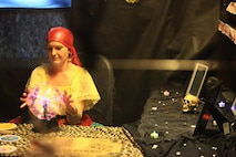 Riley A. Flynn, a volunteer with Combat Logistics Regiment 27, 2nd Marine Logistics Group, dresses as a fortune teller at the unit’s haunted house aboard Camp Lejeune, N.C., Oct. 21, 2012. Volunteers and servicemembers with the unit organized and acted as role players for the regiment’s haunted house to entertain the families of CLR-27. 