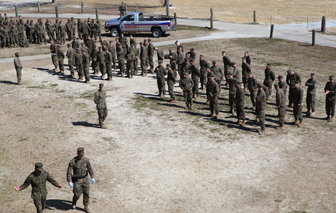 Marines wait during a health-and-comfort inspection, while others move to inspect a new area at the barracks of 8th Engineer Support Battalion aboard Marine Corps Base Camp Lejeune March 4. The health-and-comfort inspection was conducted by the commanding officer of 8th ESB with support from the Provost Marshall’s Office, 2nd Law Enforcement Battalion, Jacksonville Police Department and the base’s Special Response Team.